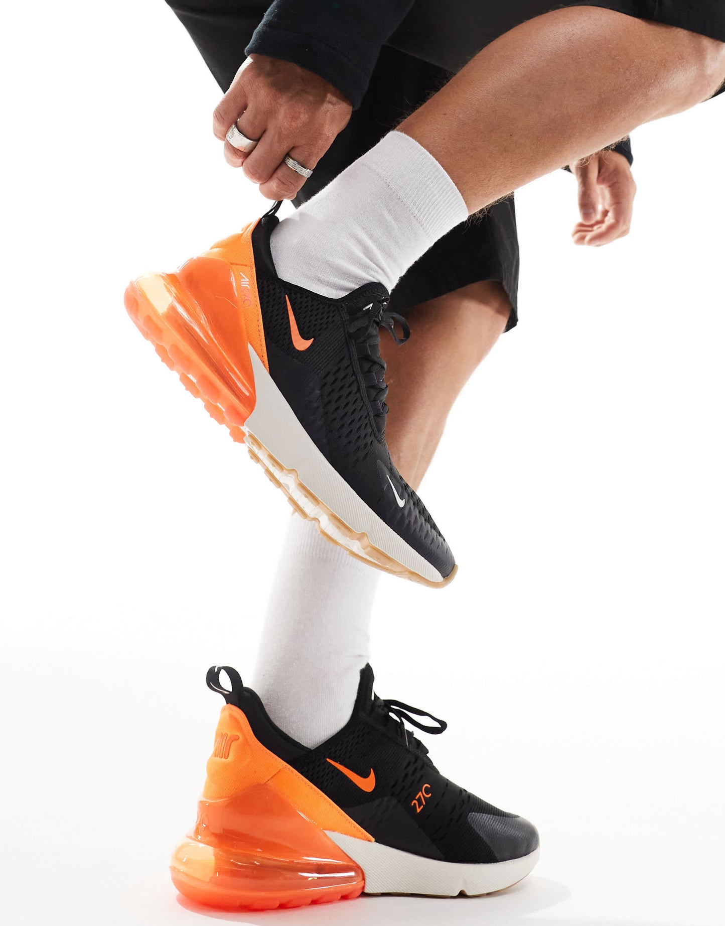 Nike Air Max 270 trainers in black, orange and white