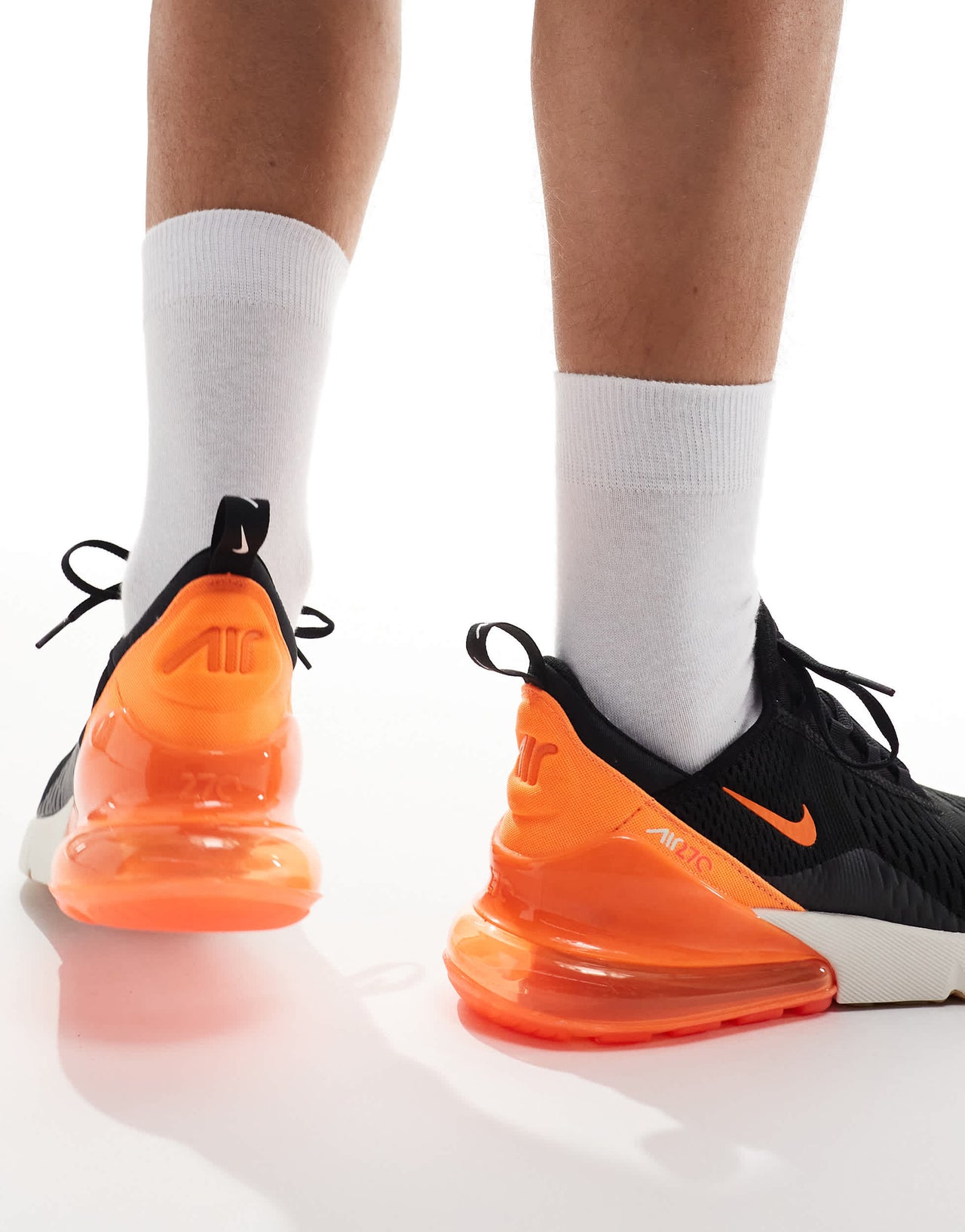 Nike Air Max 270 trainers in black, orange and white