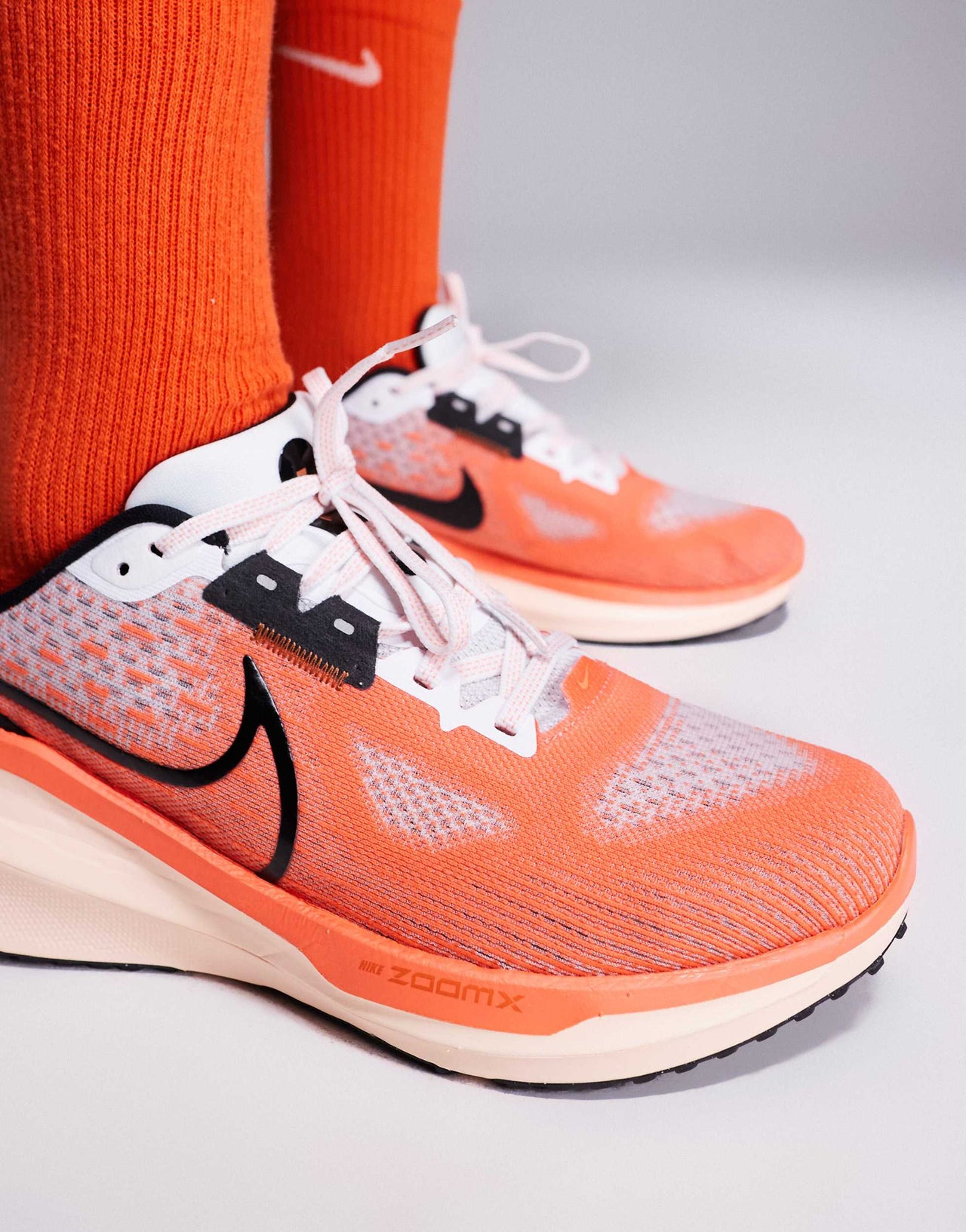Nike Running Vomero 17 trainers in white and orange