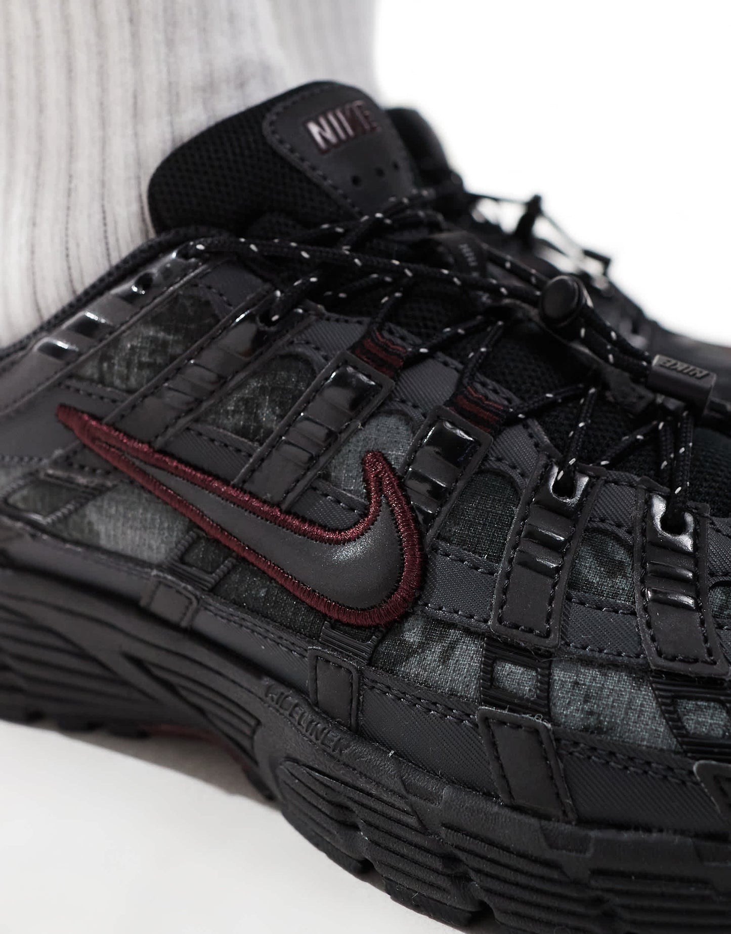 Nike P-6000 trainers in black and burgundy