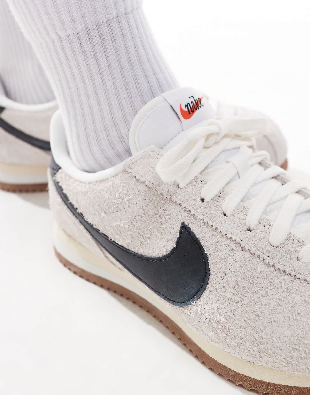 Nike Cortez suede trainers in white and black