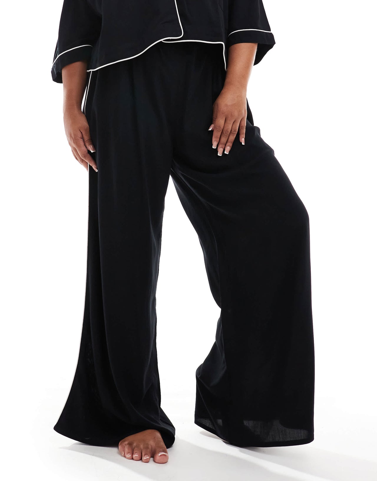 ASOS DESIGN Curve super soft slinky wide leg pyjama trouser in black with contrast binding