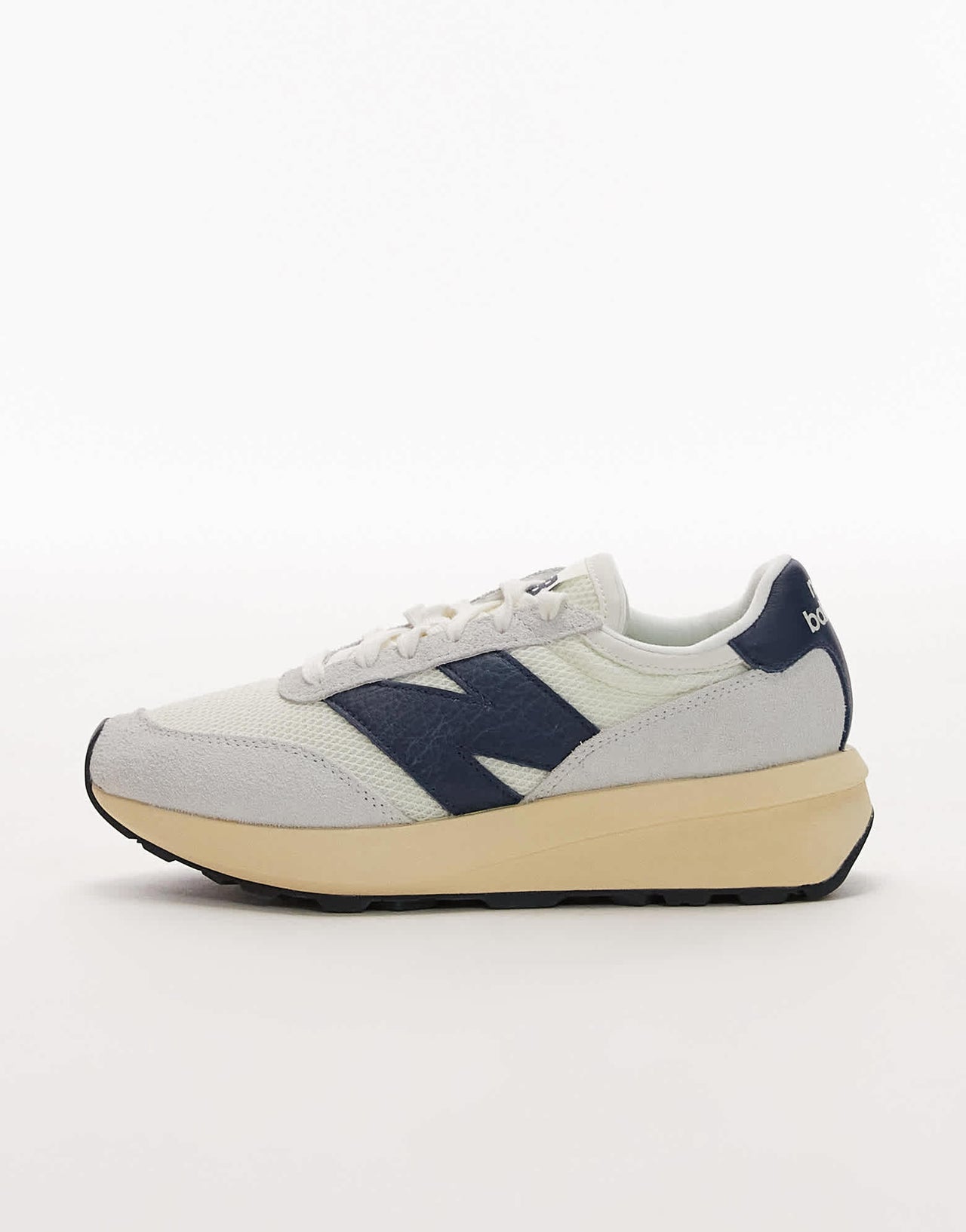 New Balance 370 trainers in white and navy