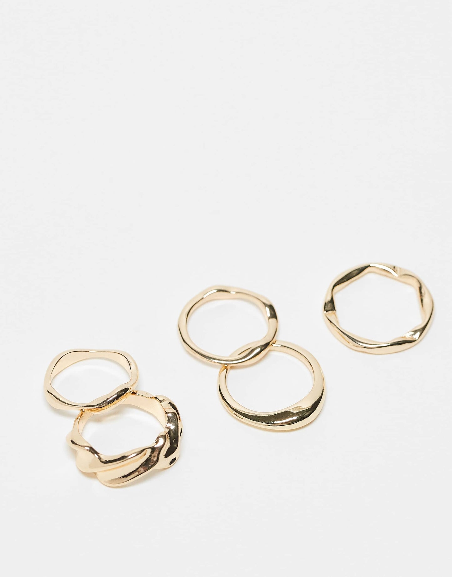 ASOS DESIGN pack of 5 rings with molten design in gold tone