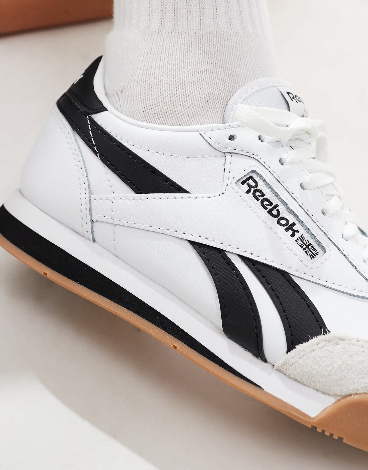 Rebook Campio XT trainers in white and black
