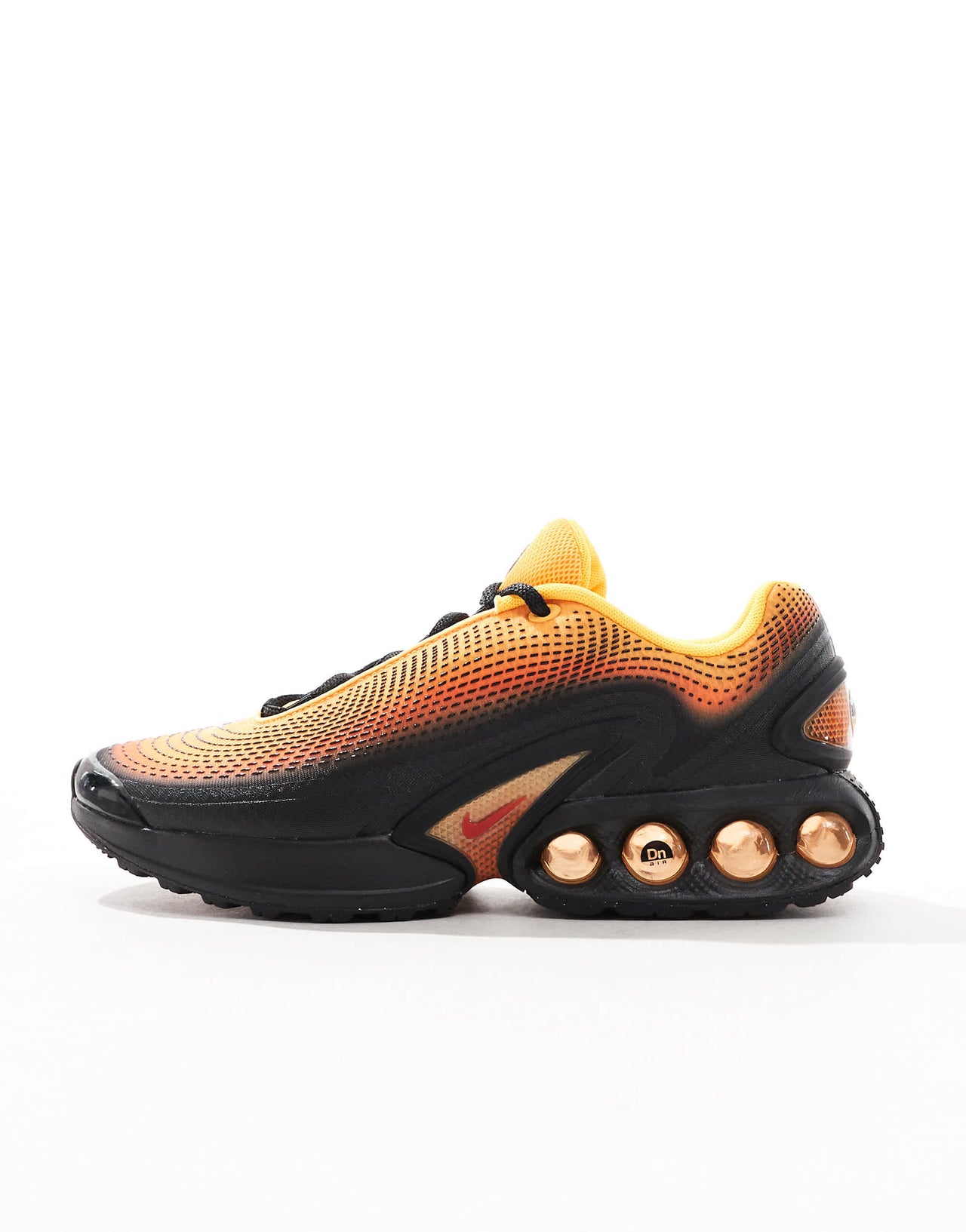 Nike Air Max DN trainers in black and orange