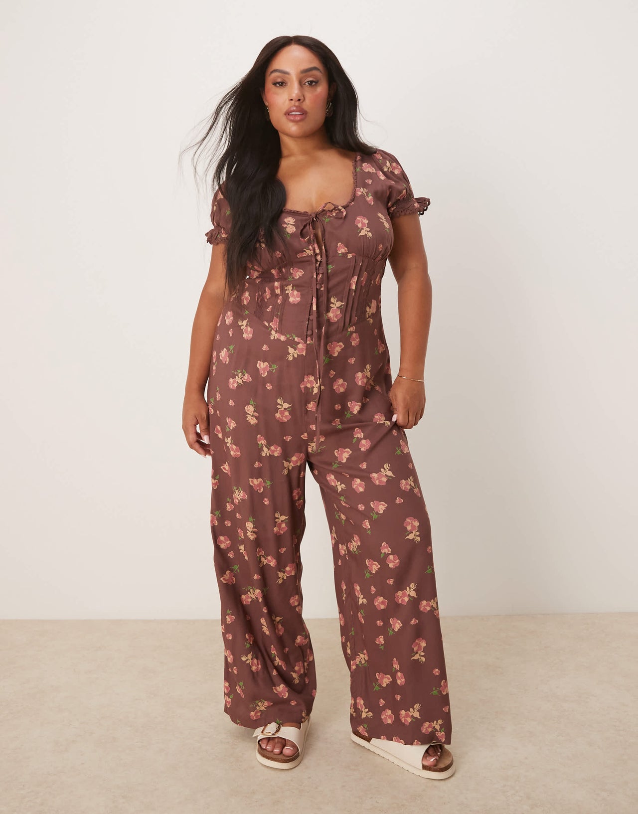 ASOS DESIGN Curve spun lace trim corset waist jumpsuit in mauve floral print