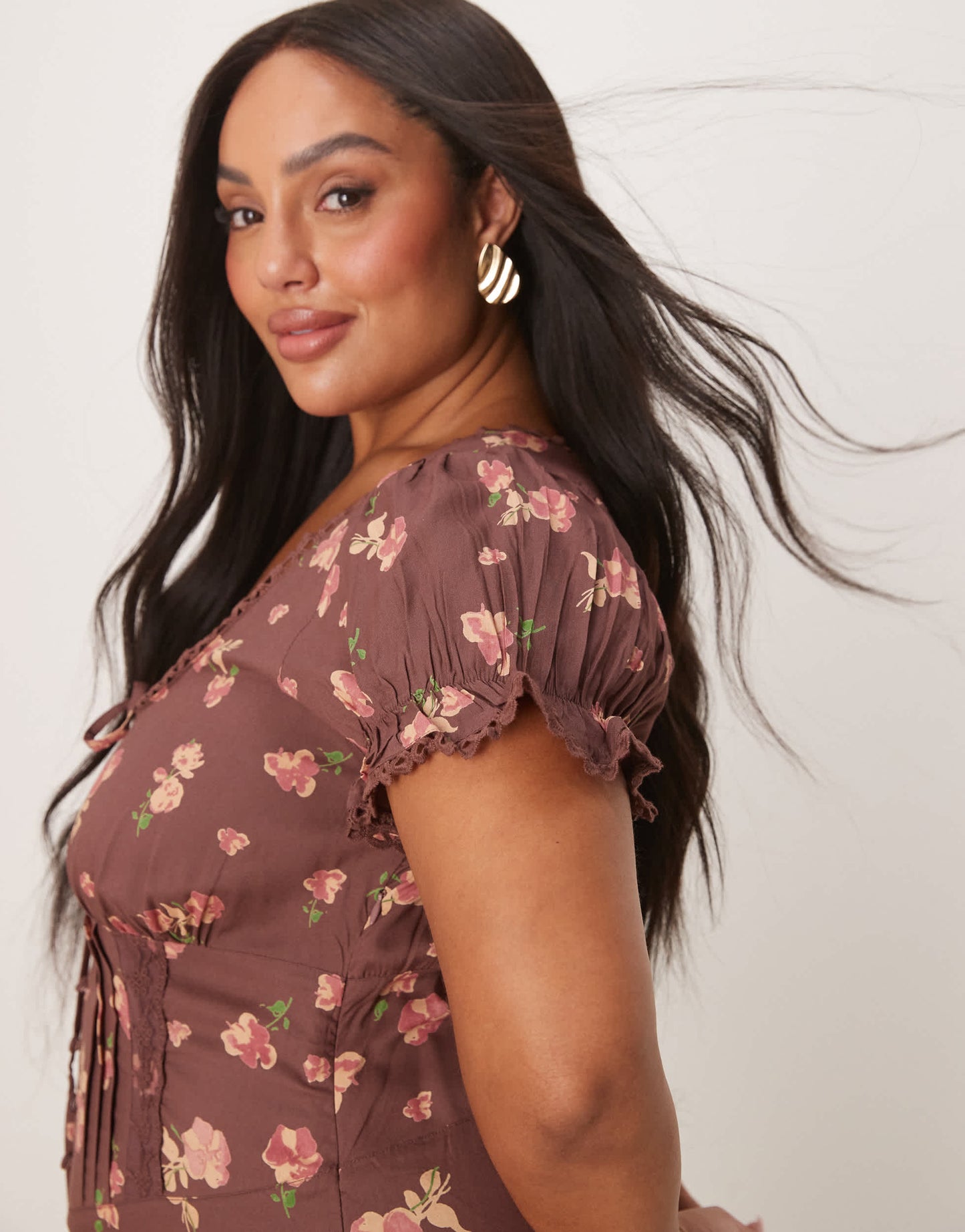 ASOS DESIGN Curve spun lace trim corset waist jumpsuit in mauve floral print