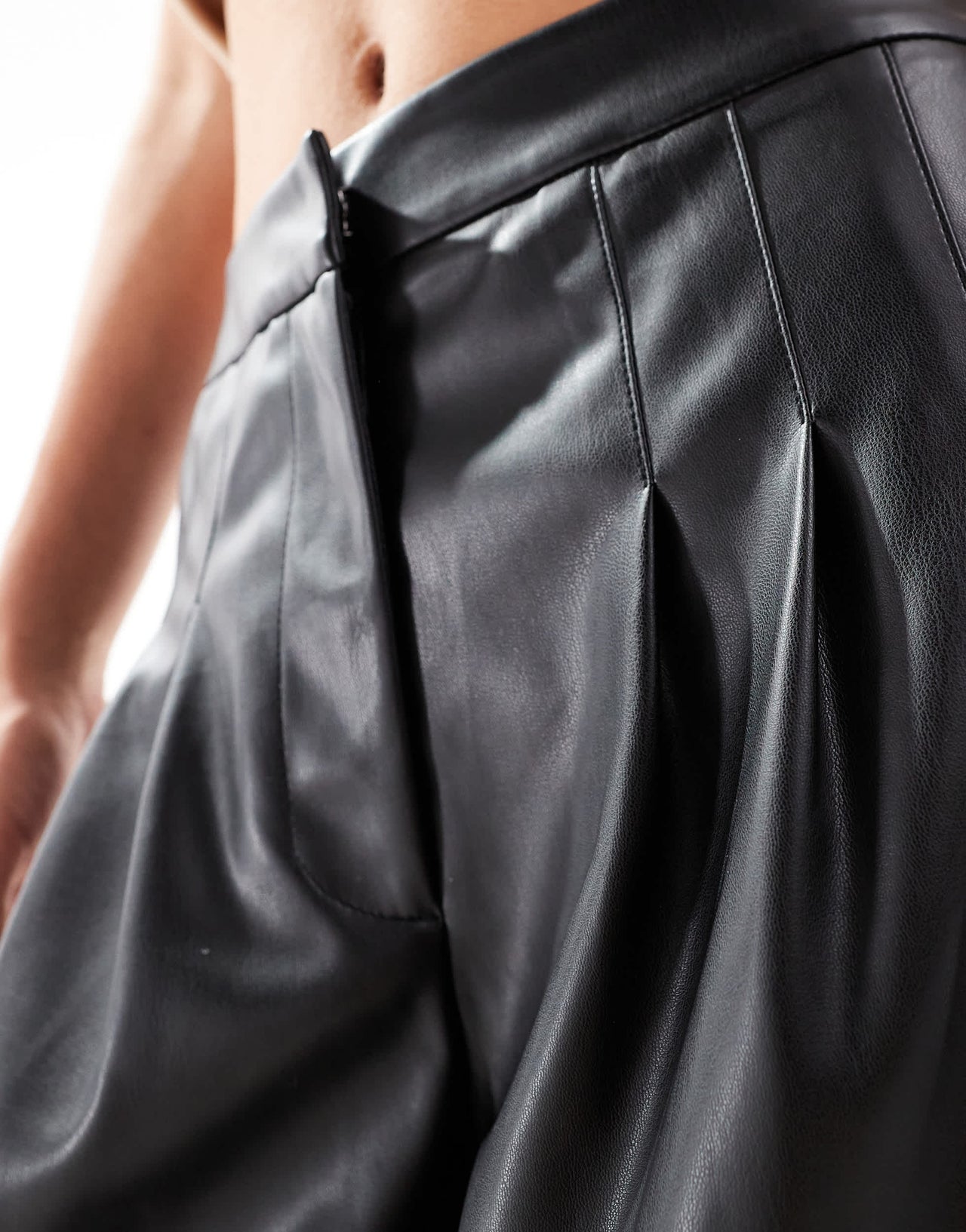 ASOS DESIGN pleat detail faux leather trouser in black