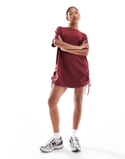 In The Style exclusive ruched side oversized mini t-shirt dress in burgundy