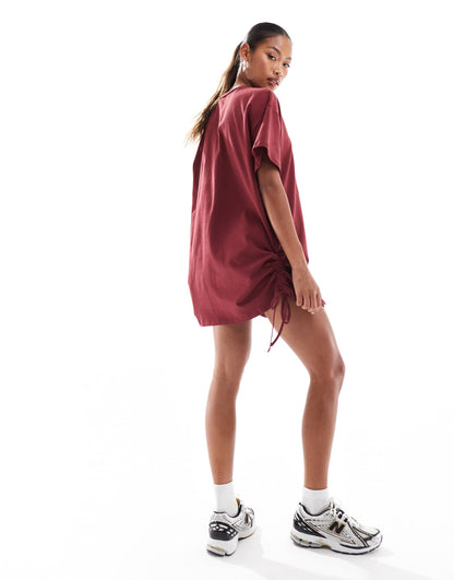 In The Style exclusive ruched side oversized mini t-shirt dress in burgundy
