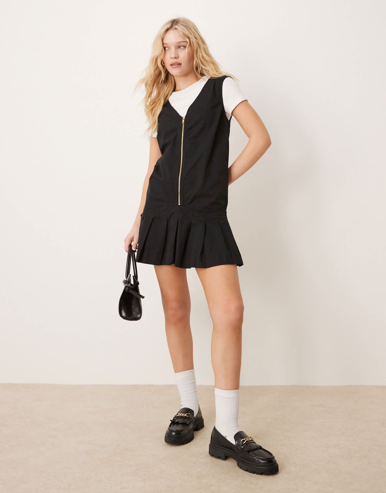 ASOS DESIGN zip through mini twill pinny dress with pleated skirt in black