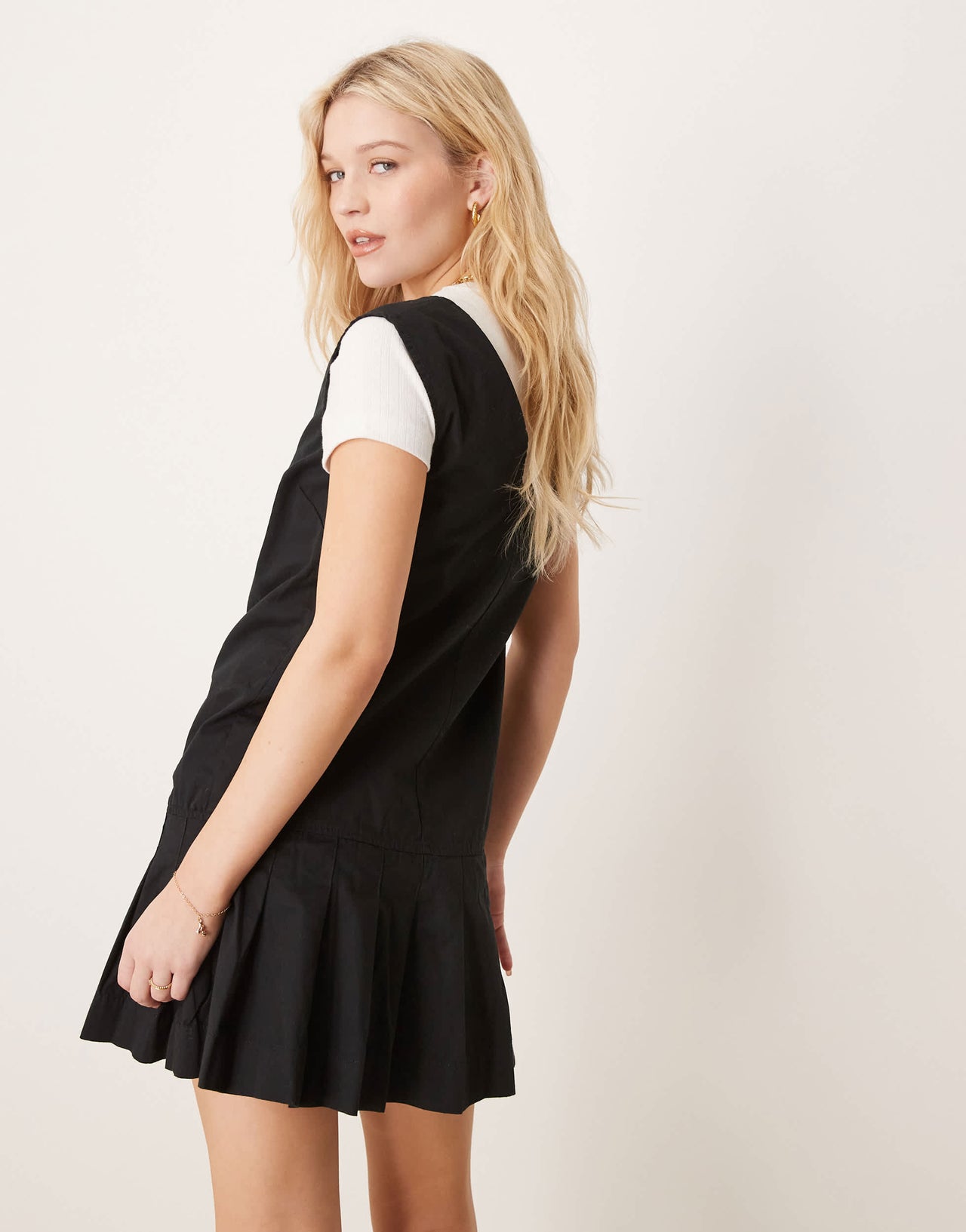ASOS DESIGN zip through mini twill pinny dress with pleated skirt in black