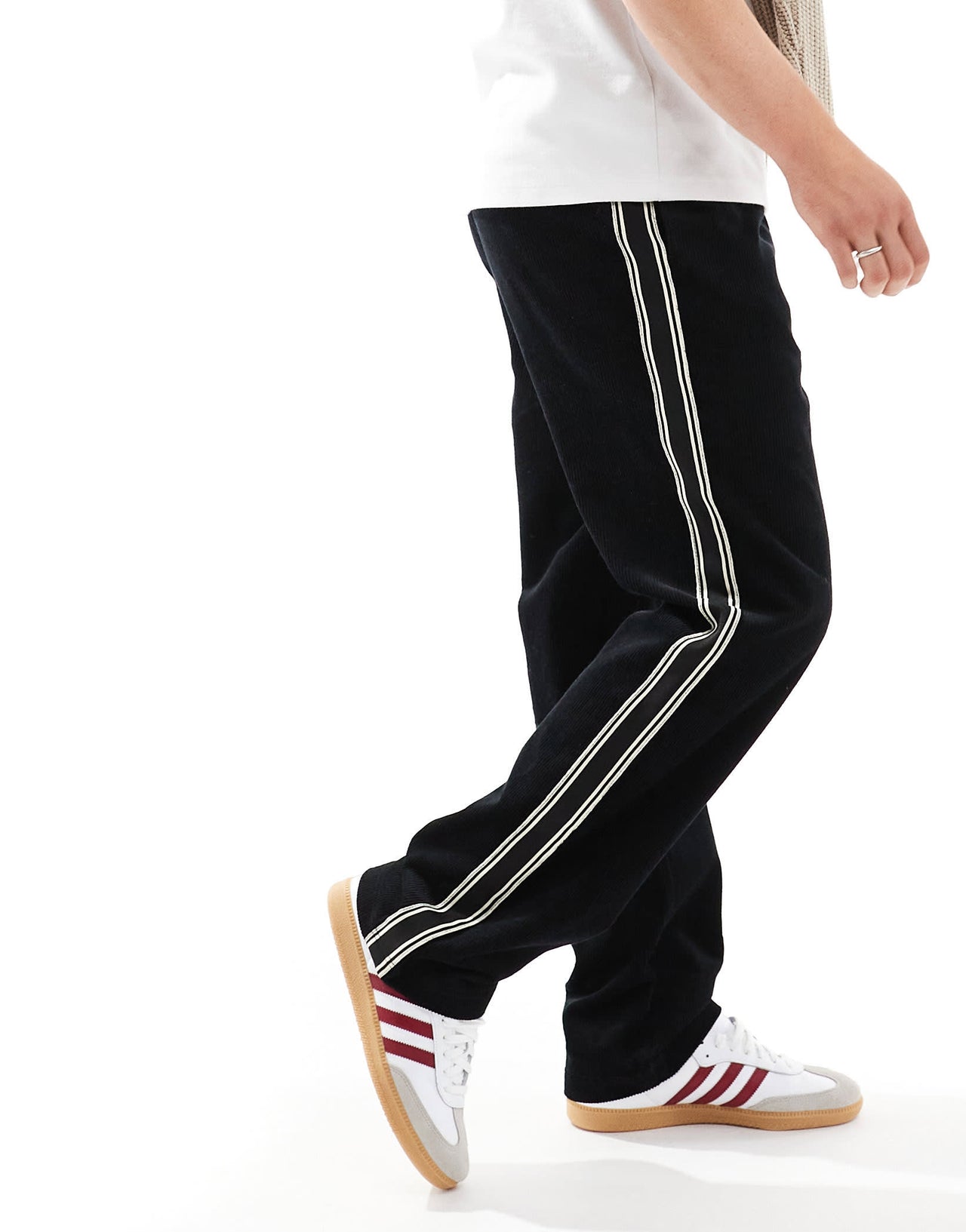 ASOS DESIGN baggy cord trousers with side taping in black