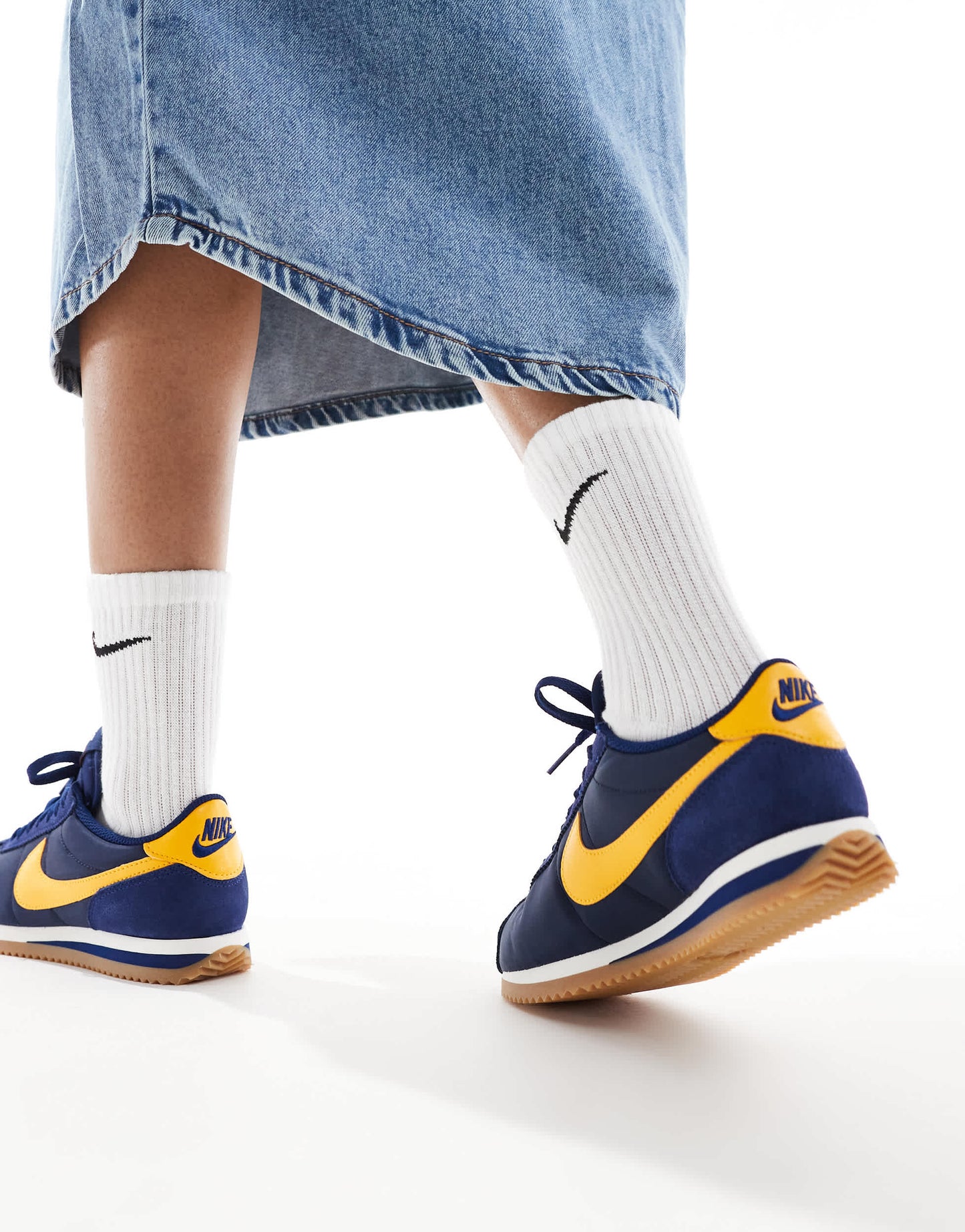 Nike Cortez trainers in navy and yellow