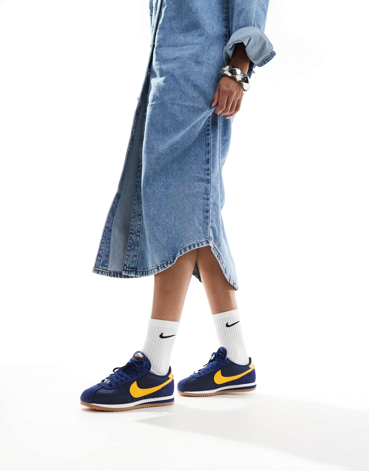 Nike Cortez trainers in navy and yellow