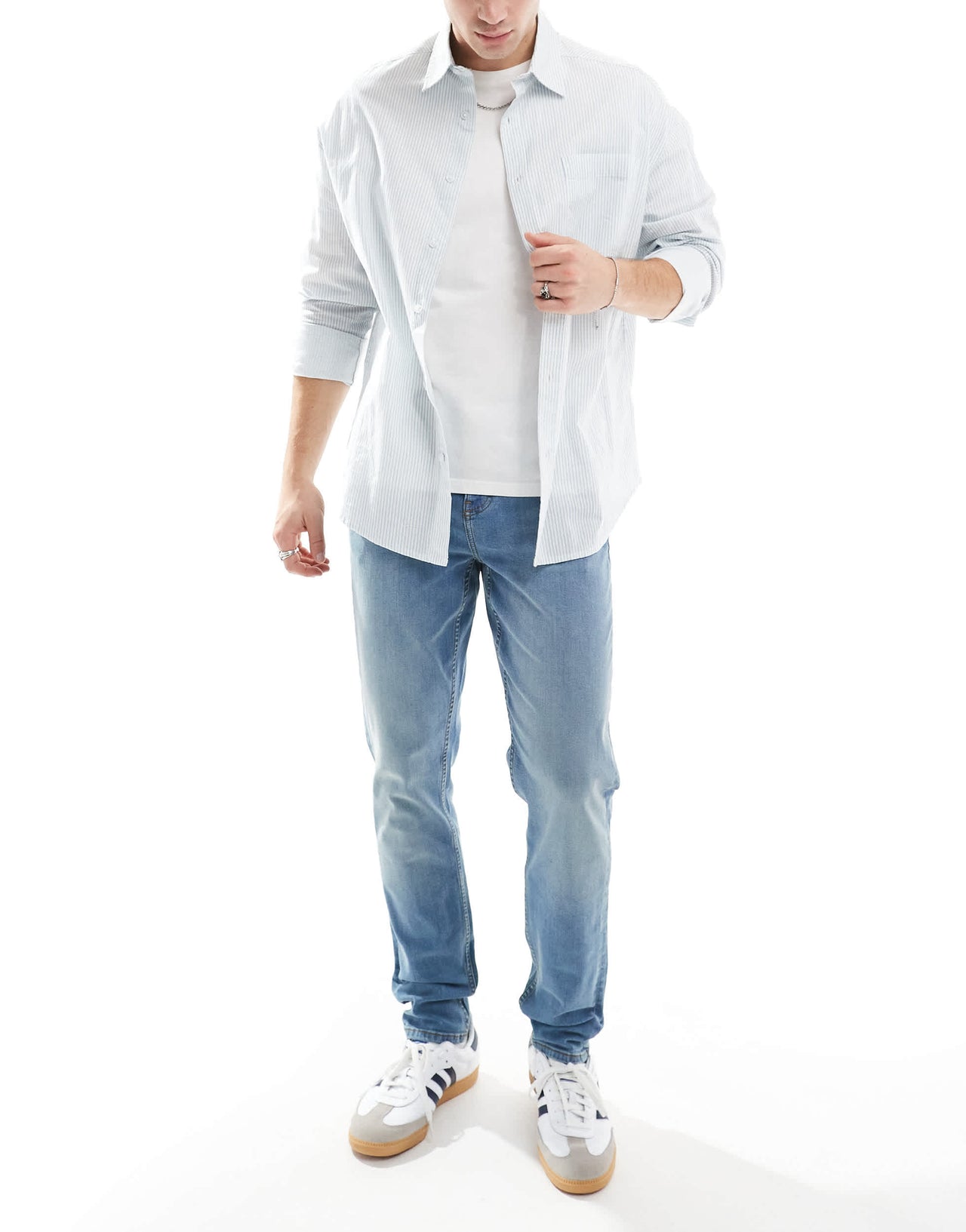 ASOS DESIGN skinny jeans with yellow tint in mid wash blue