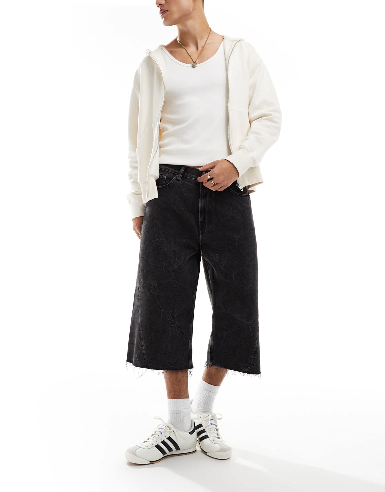 Weekday Twist low waist cropped jeans with raw hem in black acid wash