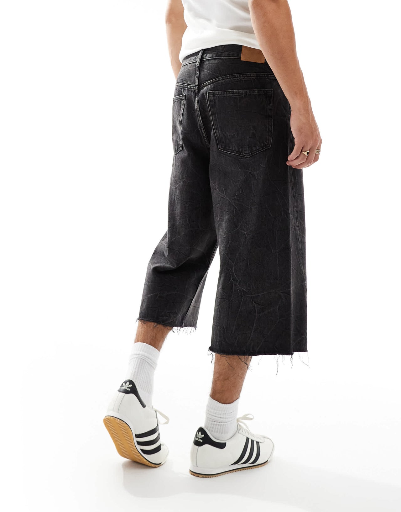 Weekday Twist low waist cropped jeans with raw hem in black acid wash