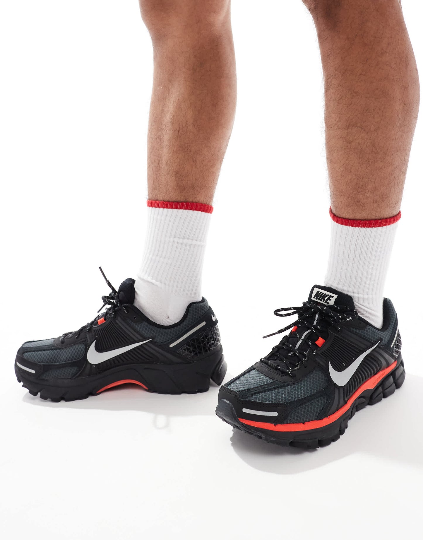 Nike Zoom Vomero 5 trainers in black and metallic silver