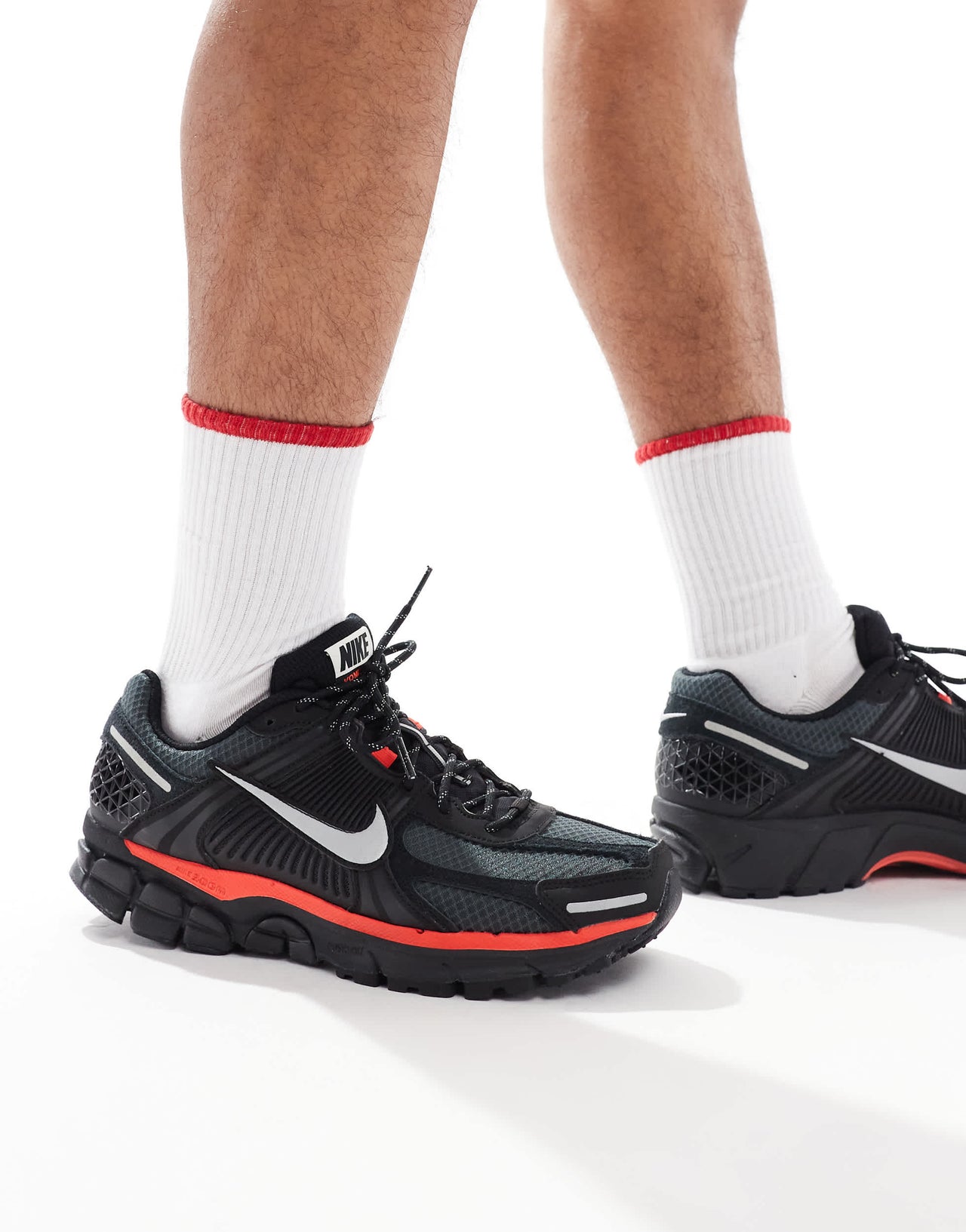 Nike Zoom Vomero 5 trainers in black and metallic silver