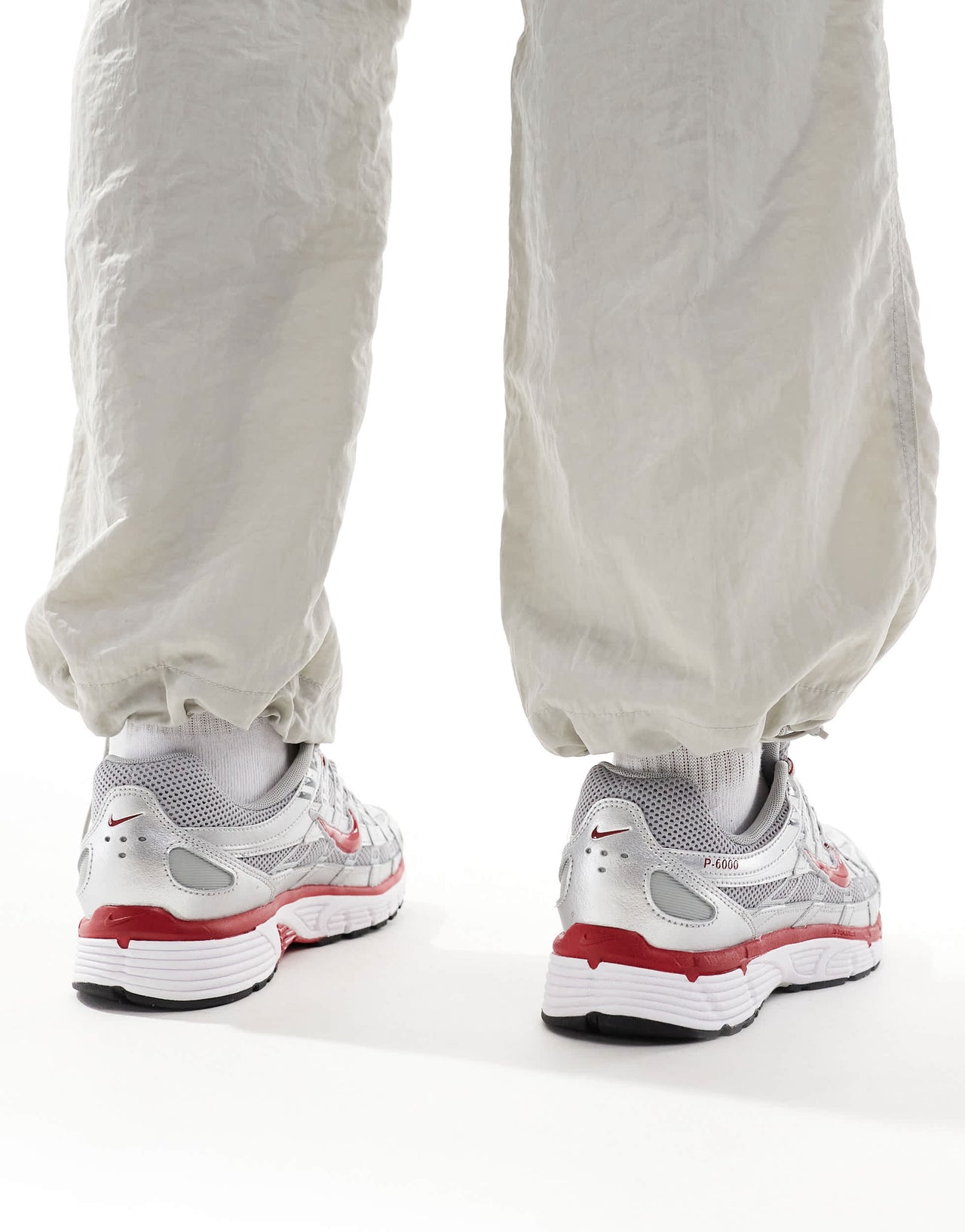 Nike P-6000 unisex trainers in metallic silver and red