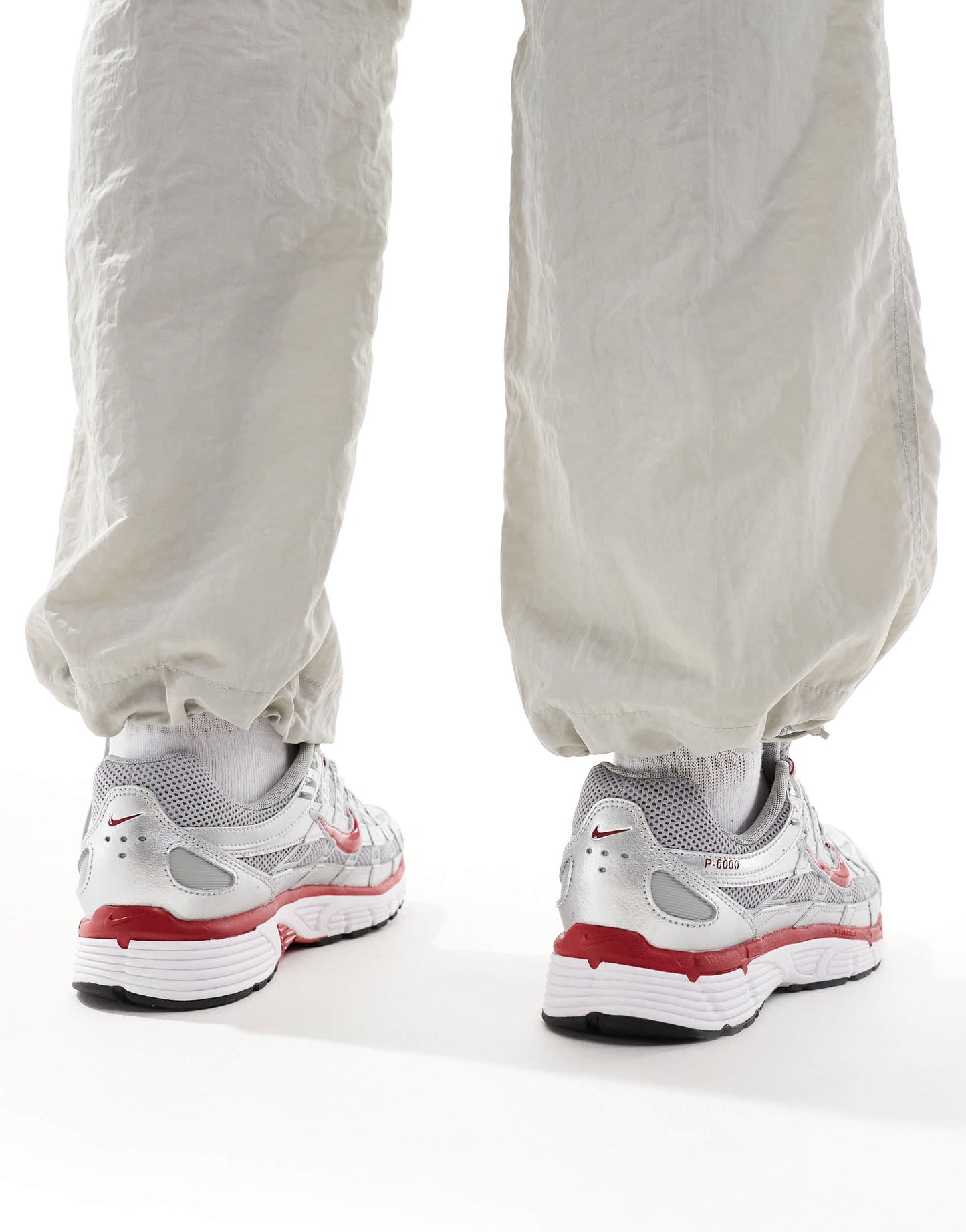 Nike P-6000 unisex trainers in metallic silver and red