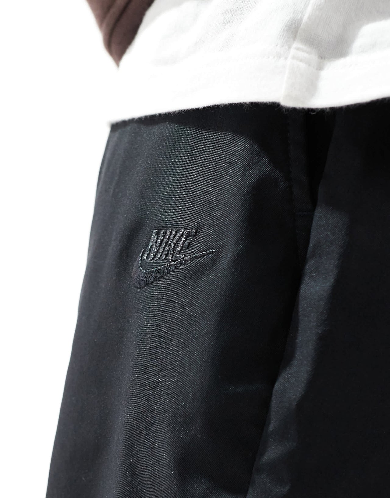 Nike Club woven tapered trousers in black