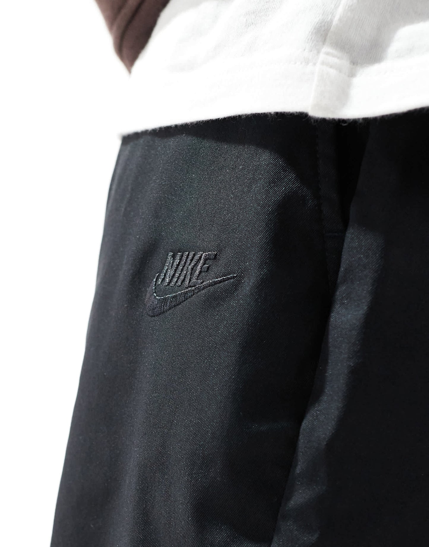 Nike Club woven tapered trousers in black