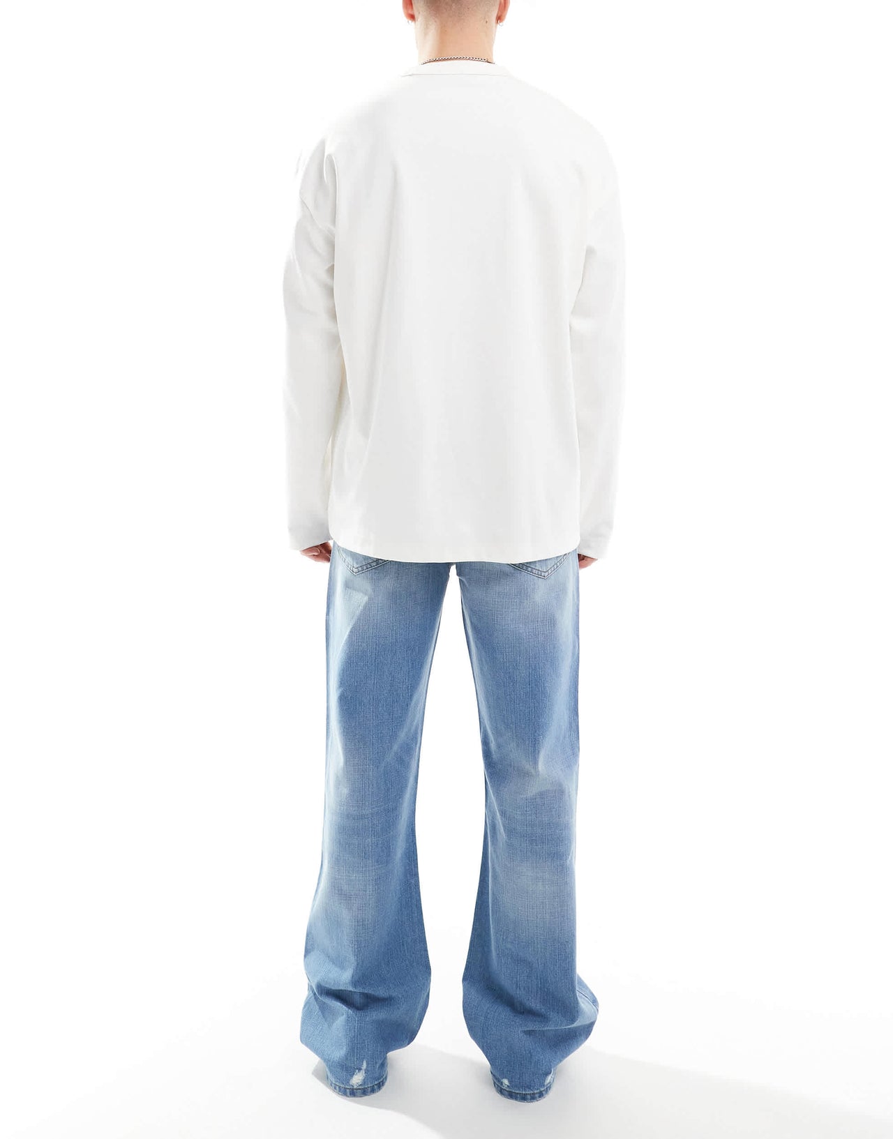 ASOS DESIGN wide flare jeans with tint & rips in mid wash blue