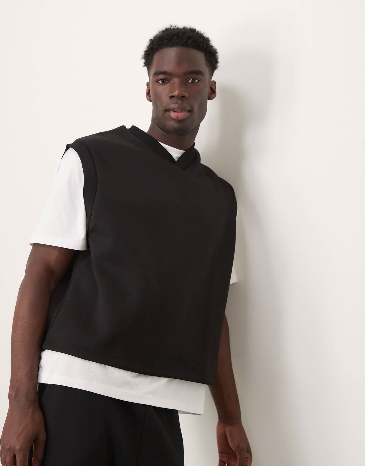 ASOS DESIGN relaxed v-neck tank top in scuba-style fabric in black