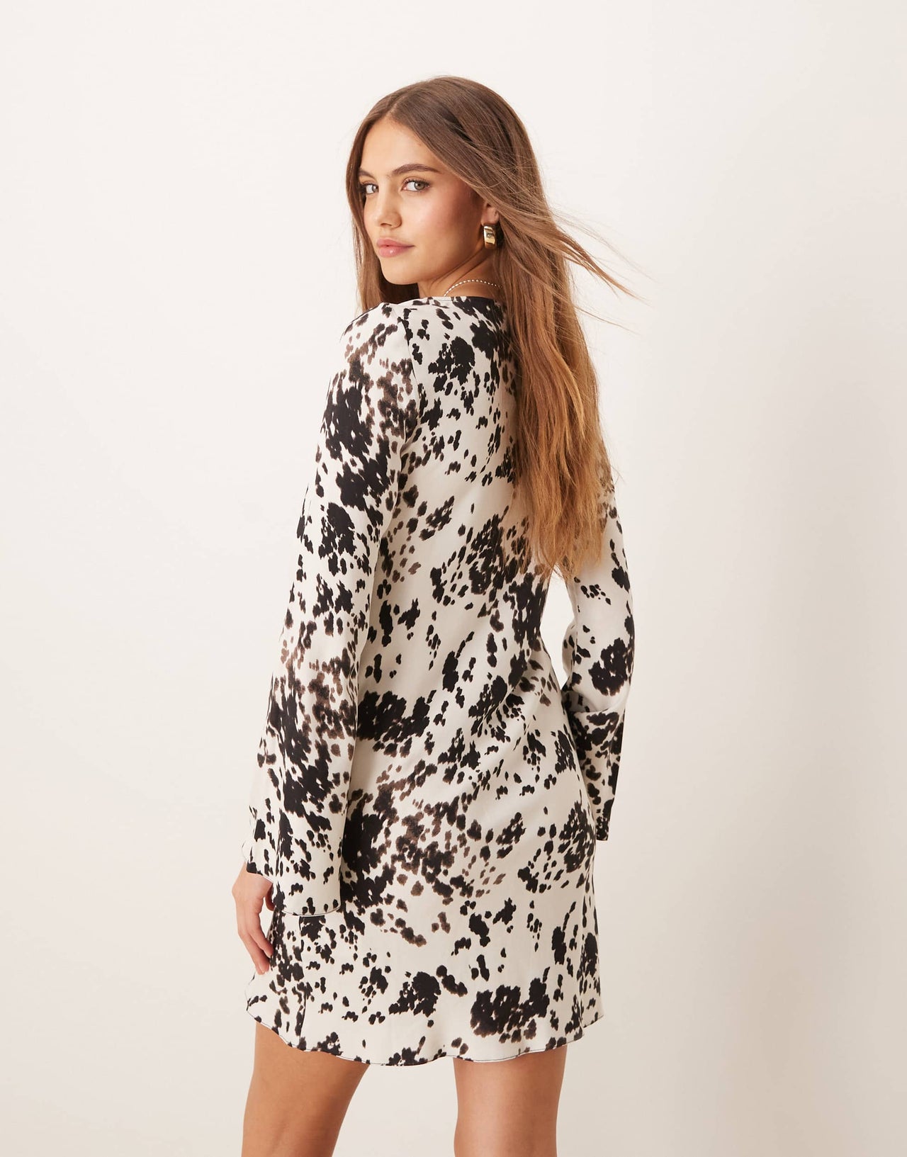 New Look long sleeve mini dress in cow print