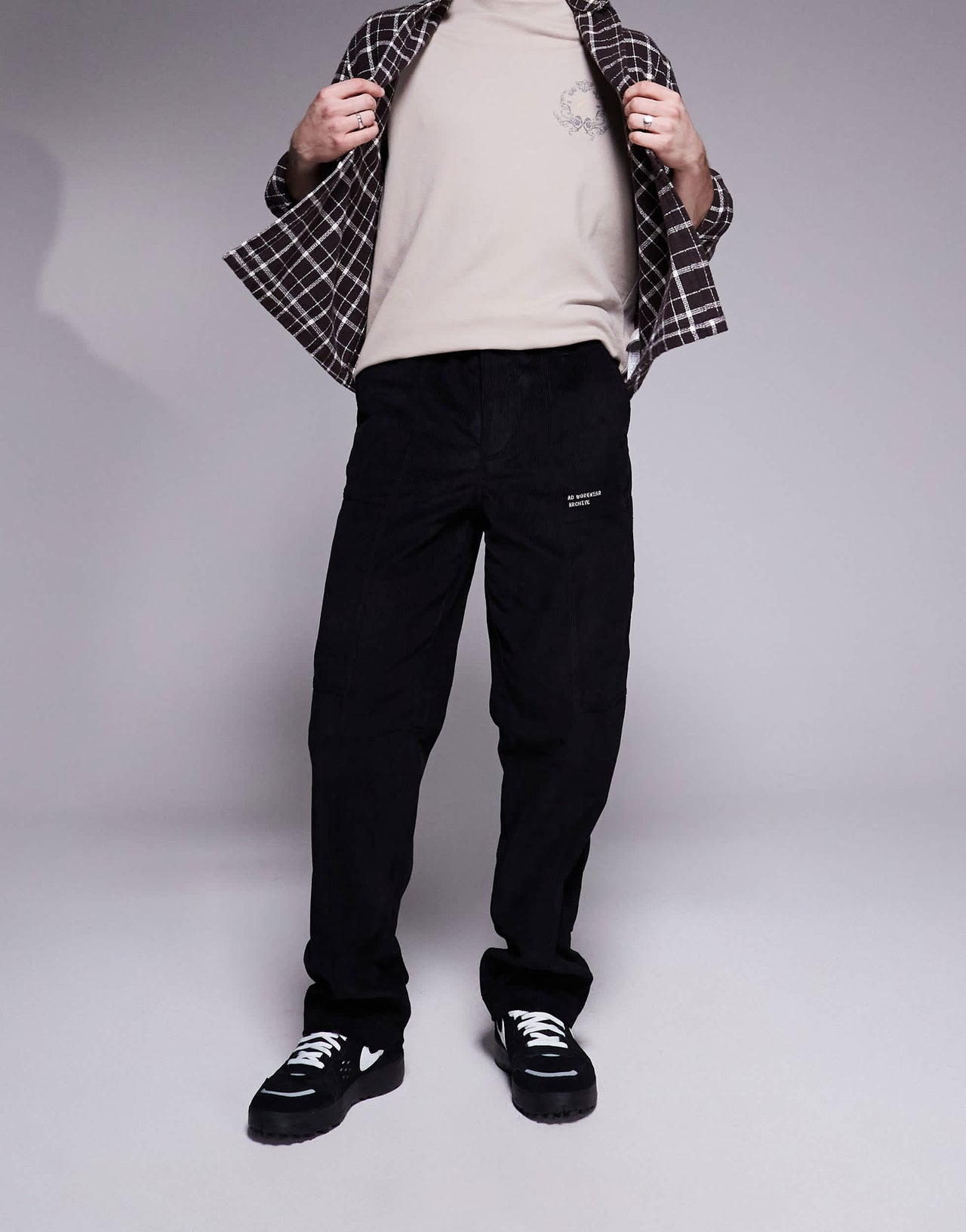 ASOS DESIGN baggy cord trousers with embroidered patch in black