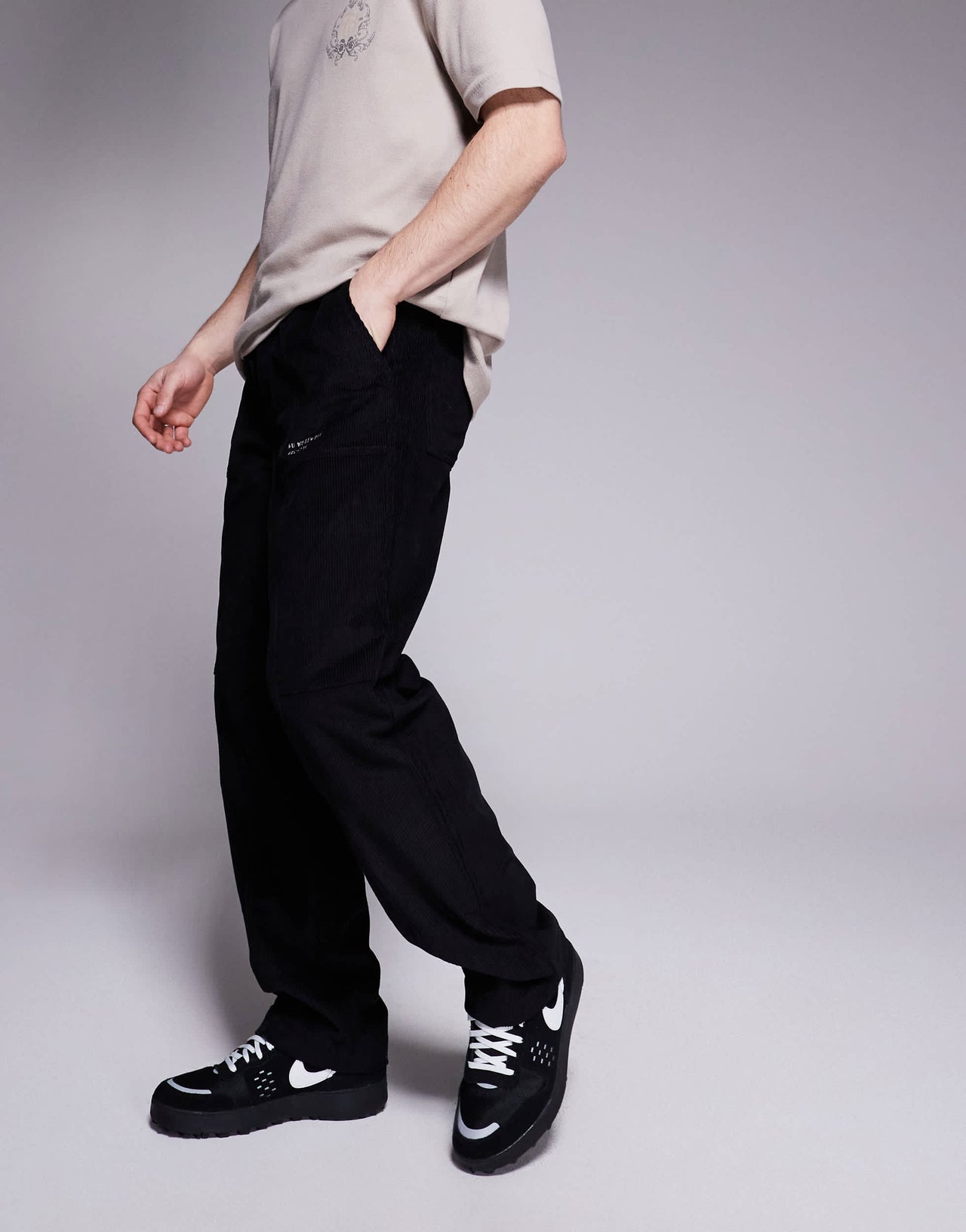 ASOS DESIGN baggy cord trousers with embroidered patch in black