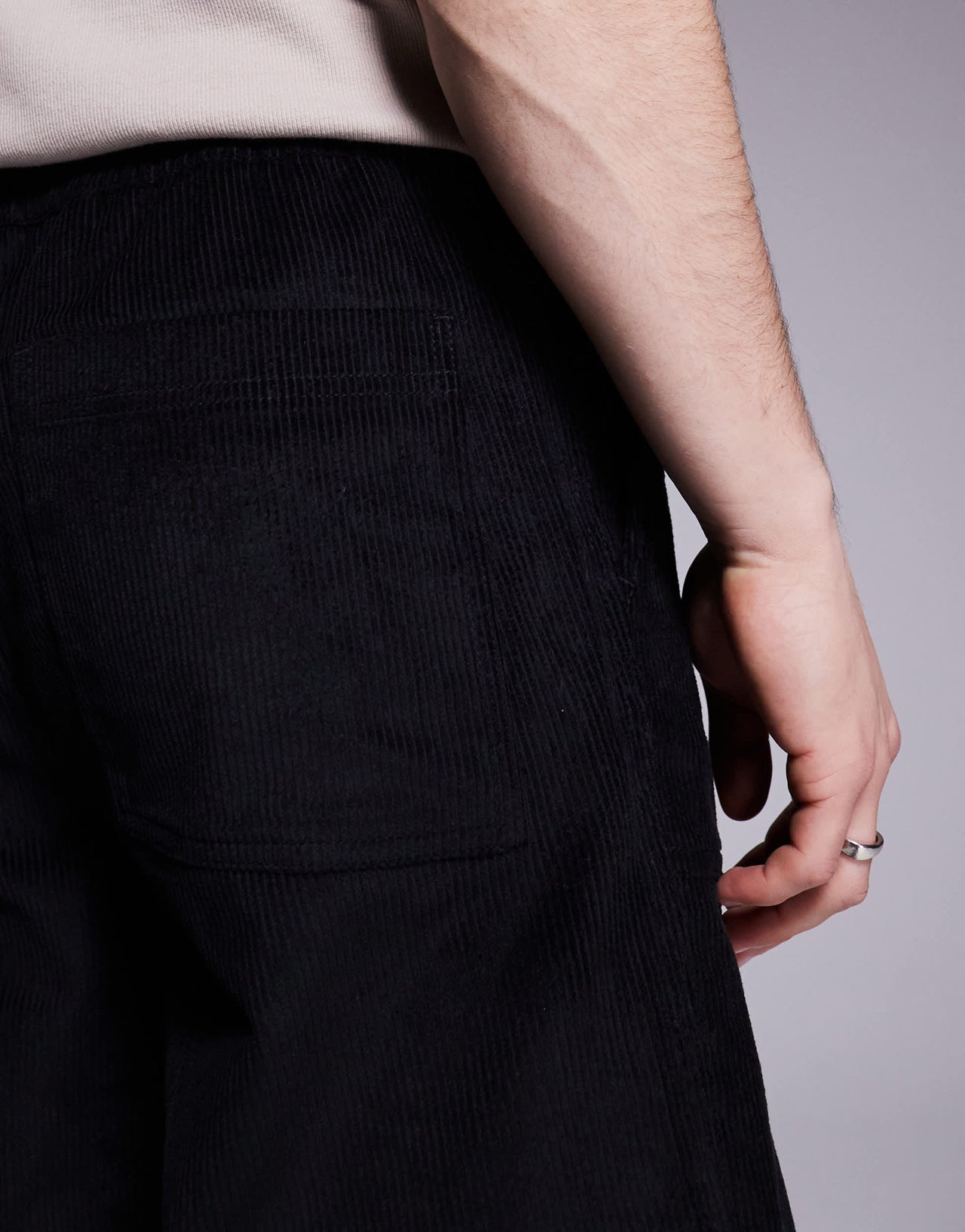 ASOS DESIGN baggy cord trousers with embroidered patch in black