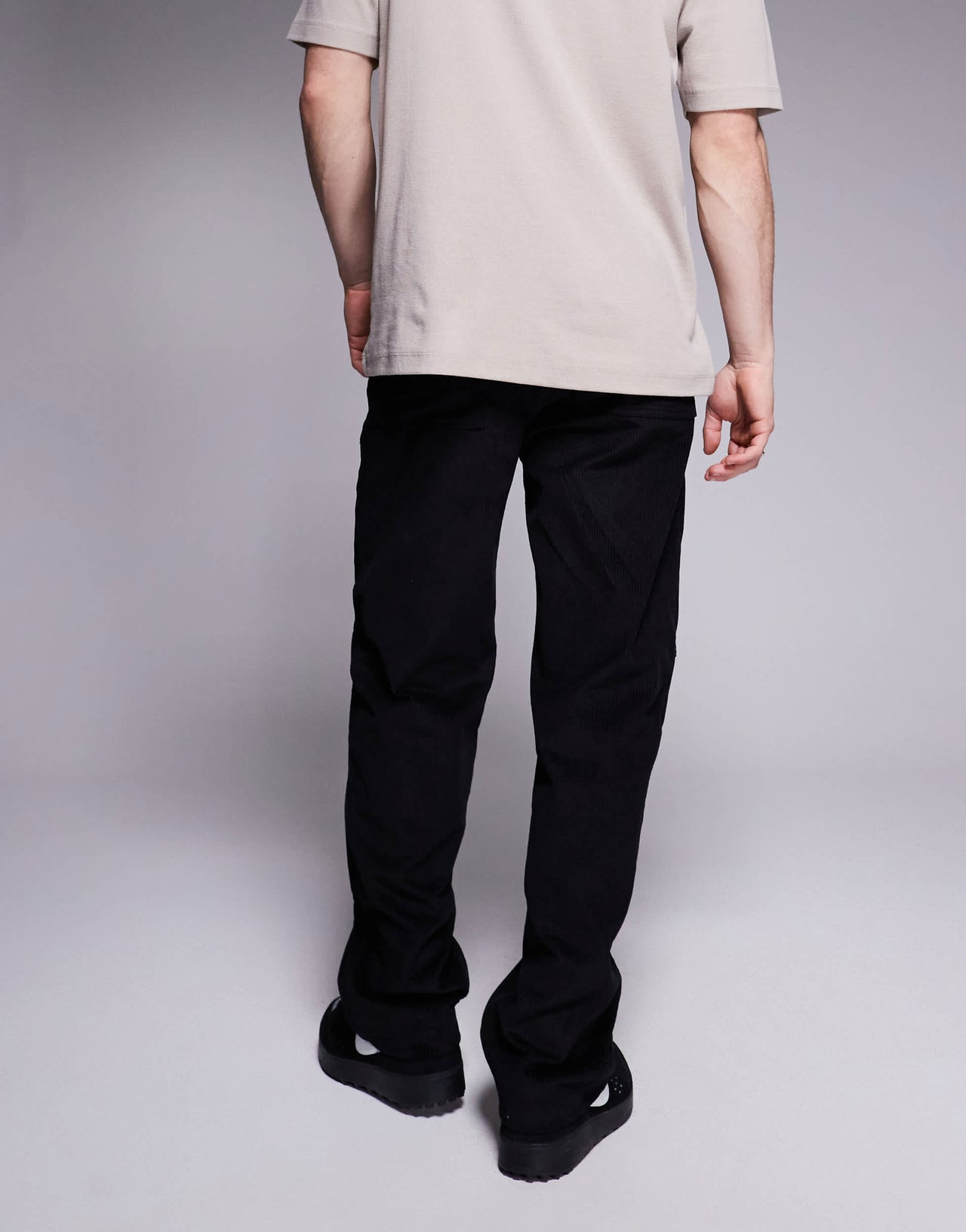 ASOS DESIGN baggy cord trousers with embroidered patch in black