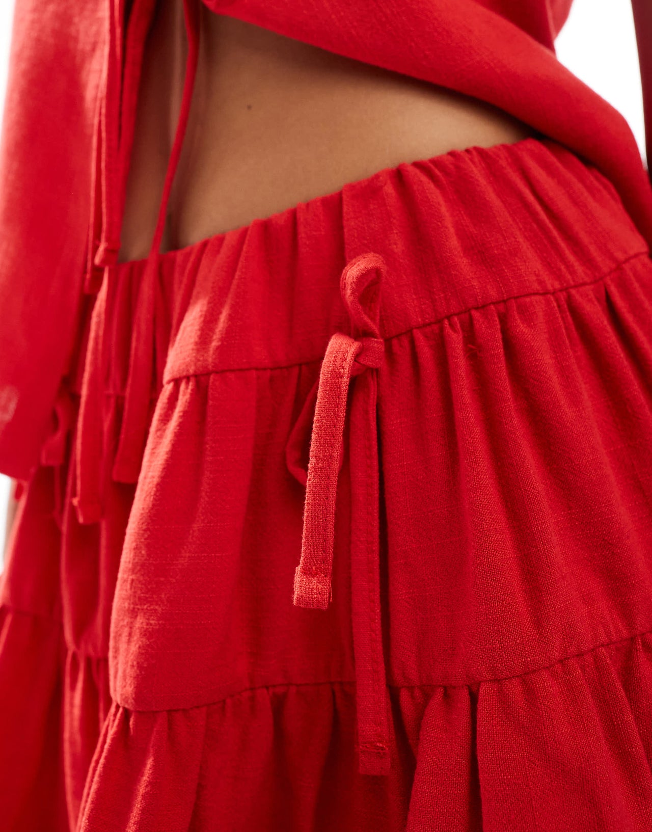 Reclaimed Vintage mini rara skirt with bows in red