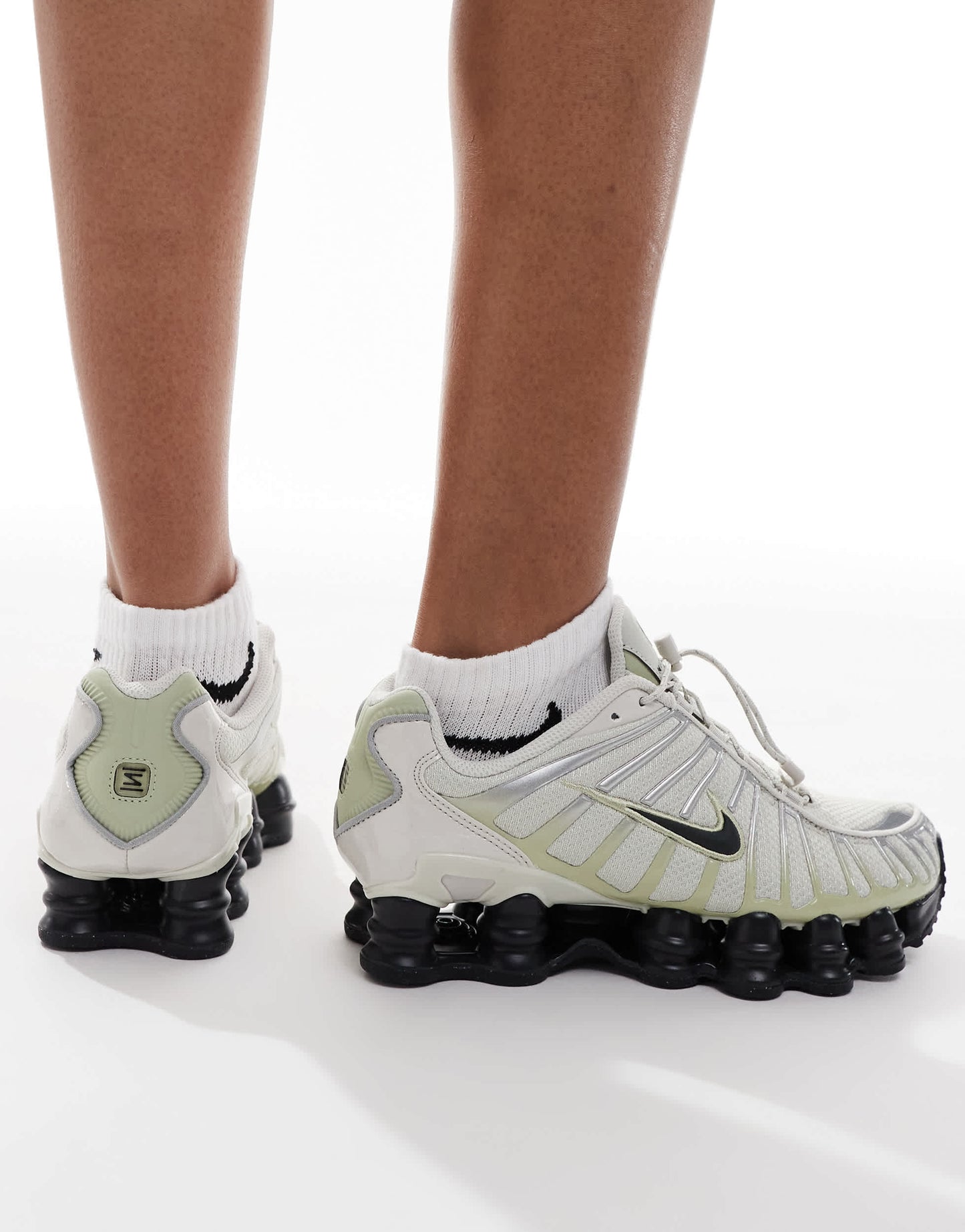 Nike Shox TL trainers in off-white and black