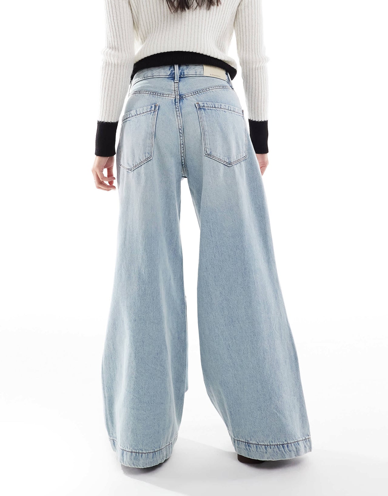 Stradivarius Petite wide flare jean in light wash blue