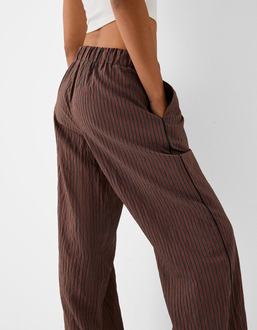 Bershka ribbon drawstring waist wide leg trousers in brown & stripe