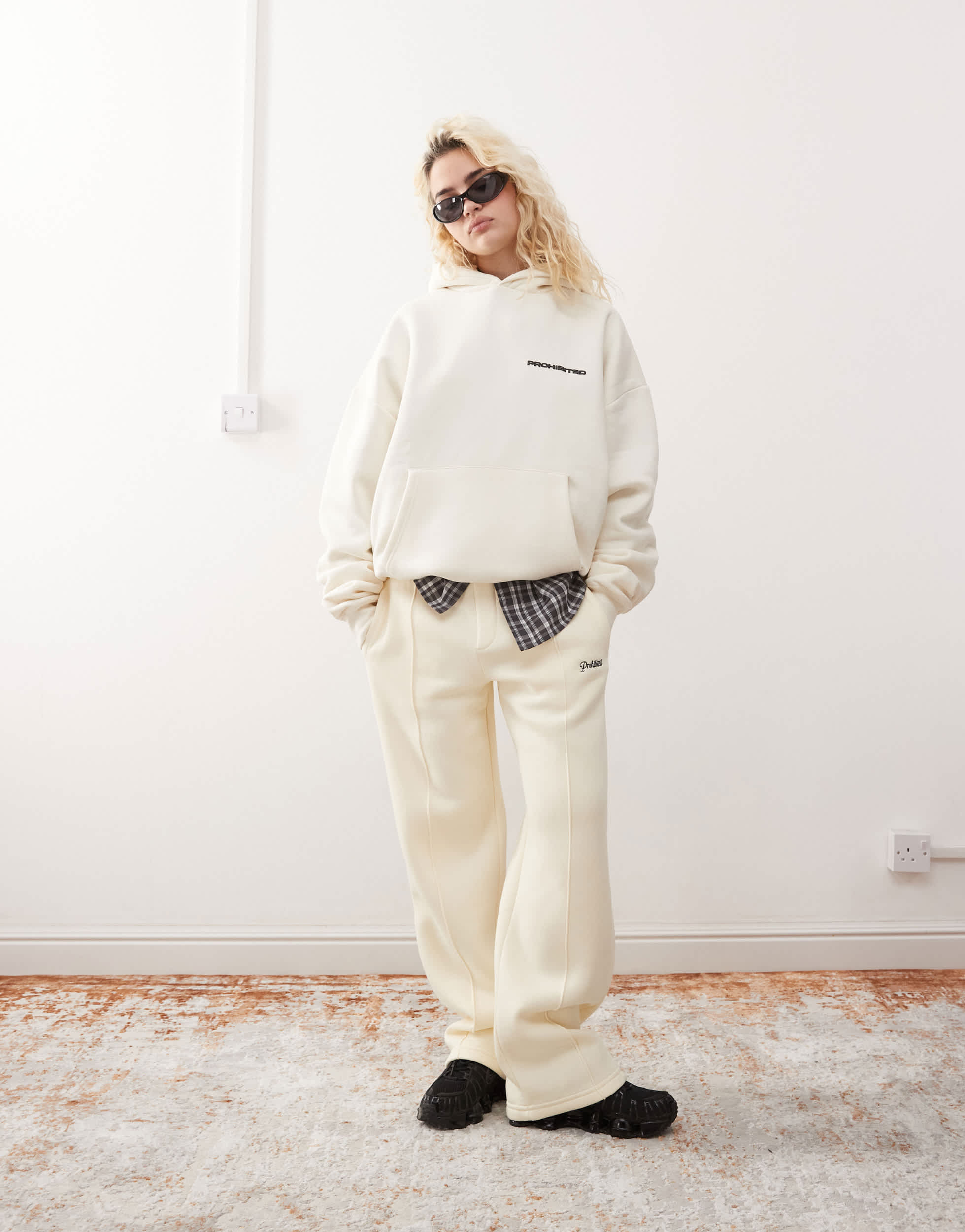 Prohibited script logo straight leg joggers in cream