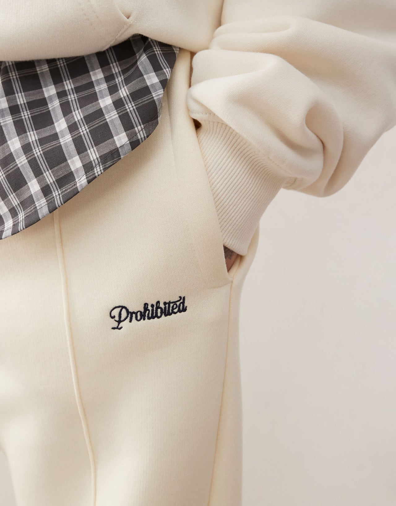 Prohibited script logo straight leg joggers in cream