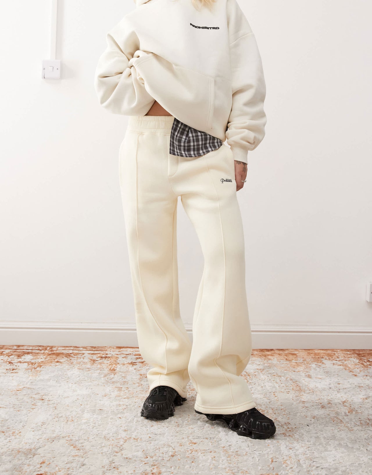 Prohibited script logo straight leg joggers in cream