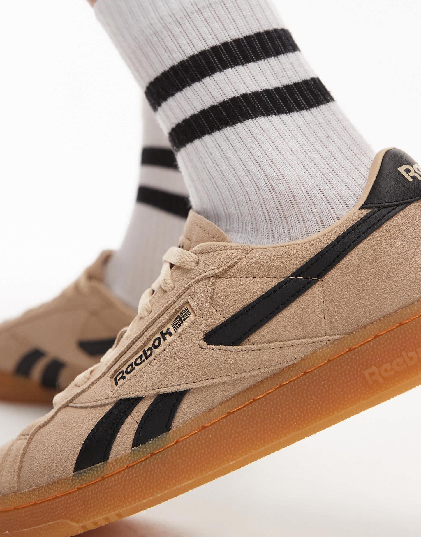 Reebok Club C Grounds trainers in tan and black
