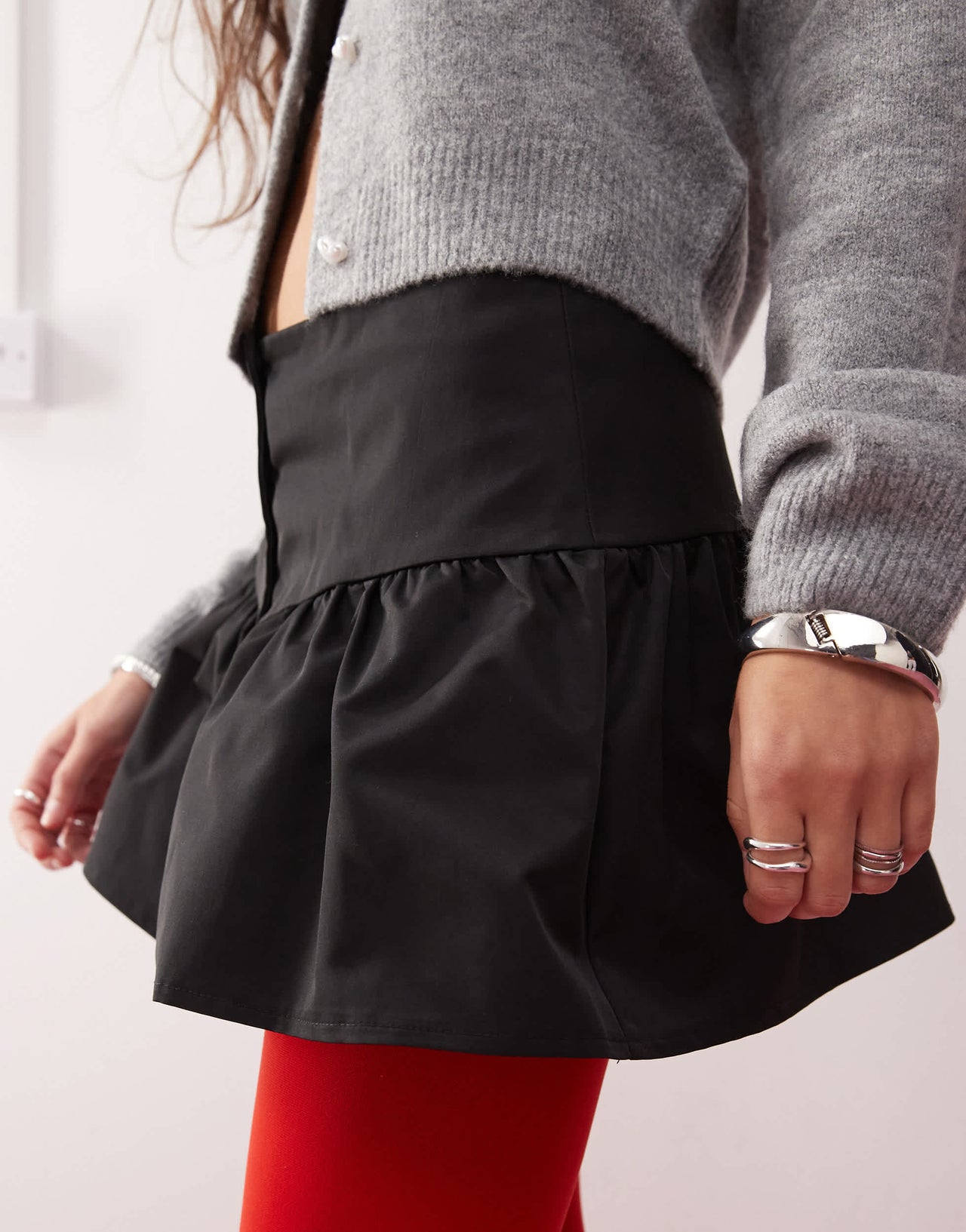 Motel rantifu button detail mini skirt in black