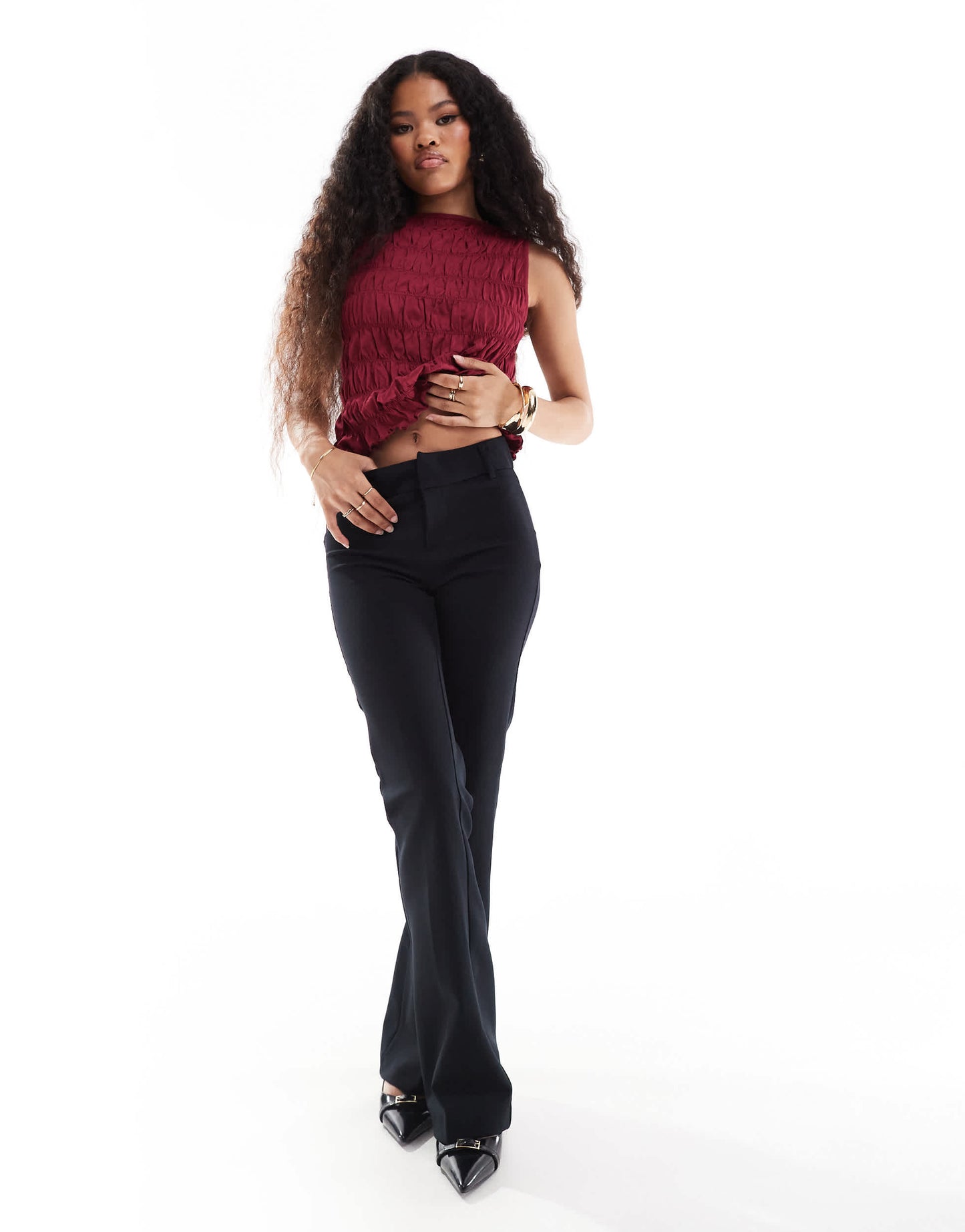 Bershka Petite flared tailored trousers in black