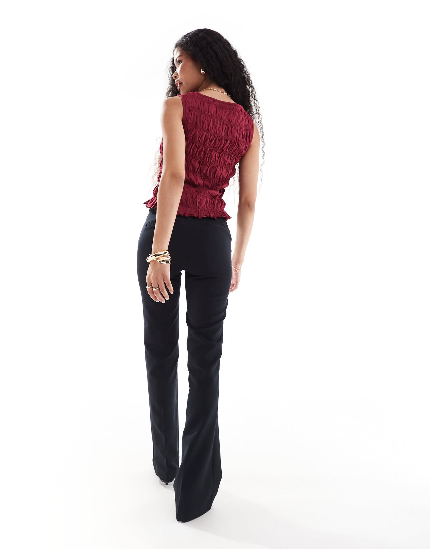 Bershka Petite flared tailored trousers in black