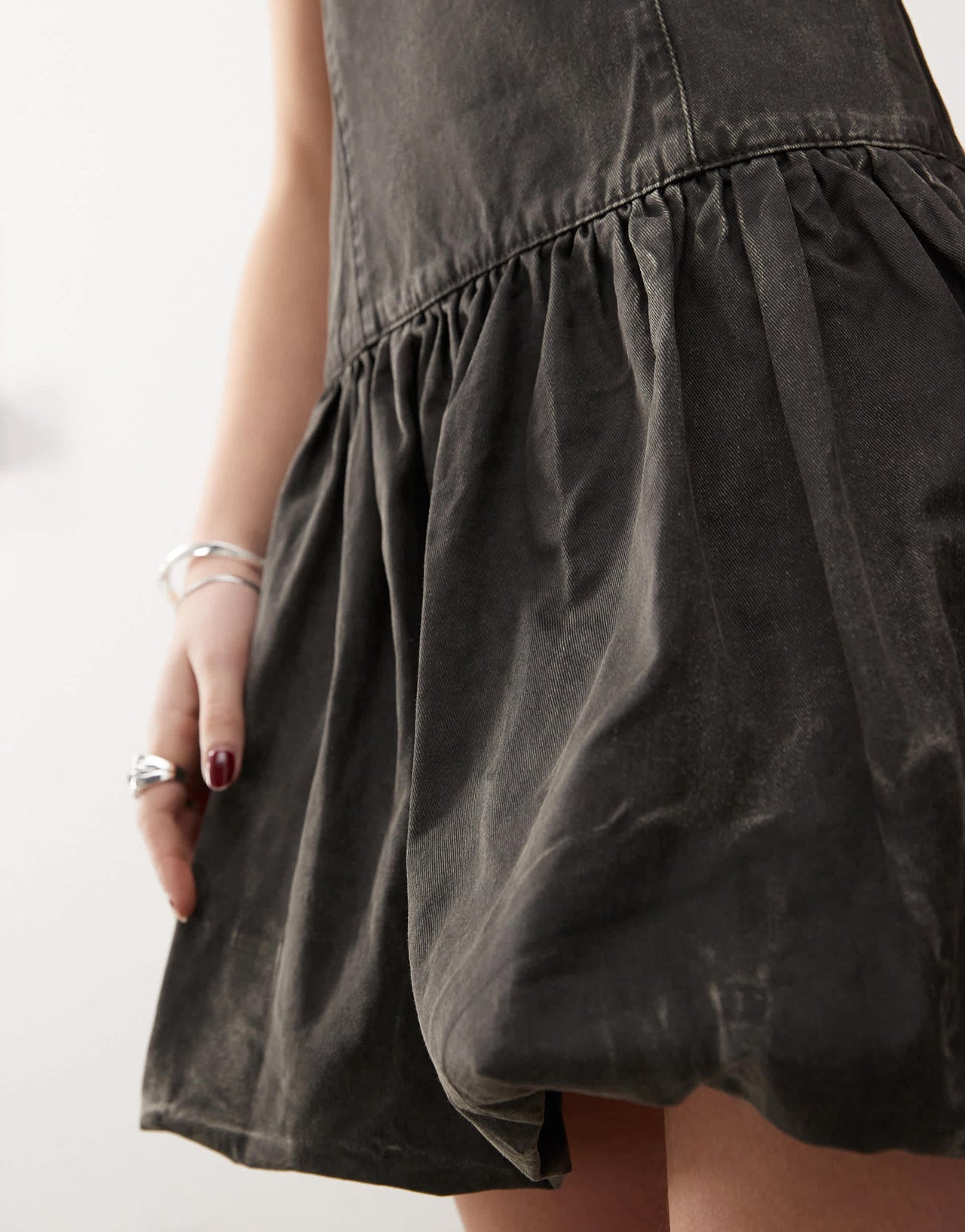 COLLUSION coated bubble hem mini dress in washed black