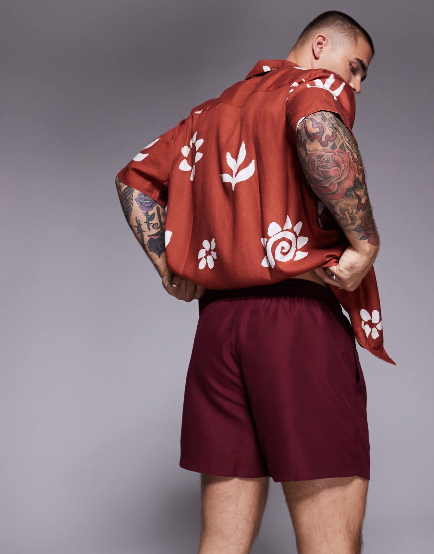 ASOS DESIGN swim shorts in short length in burgundy