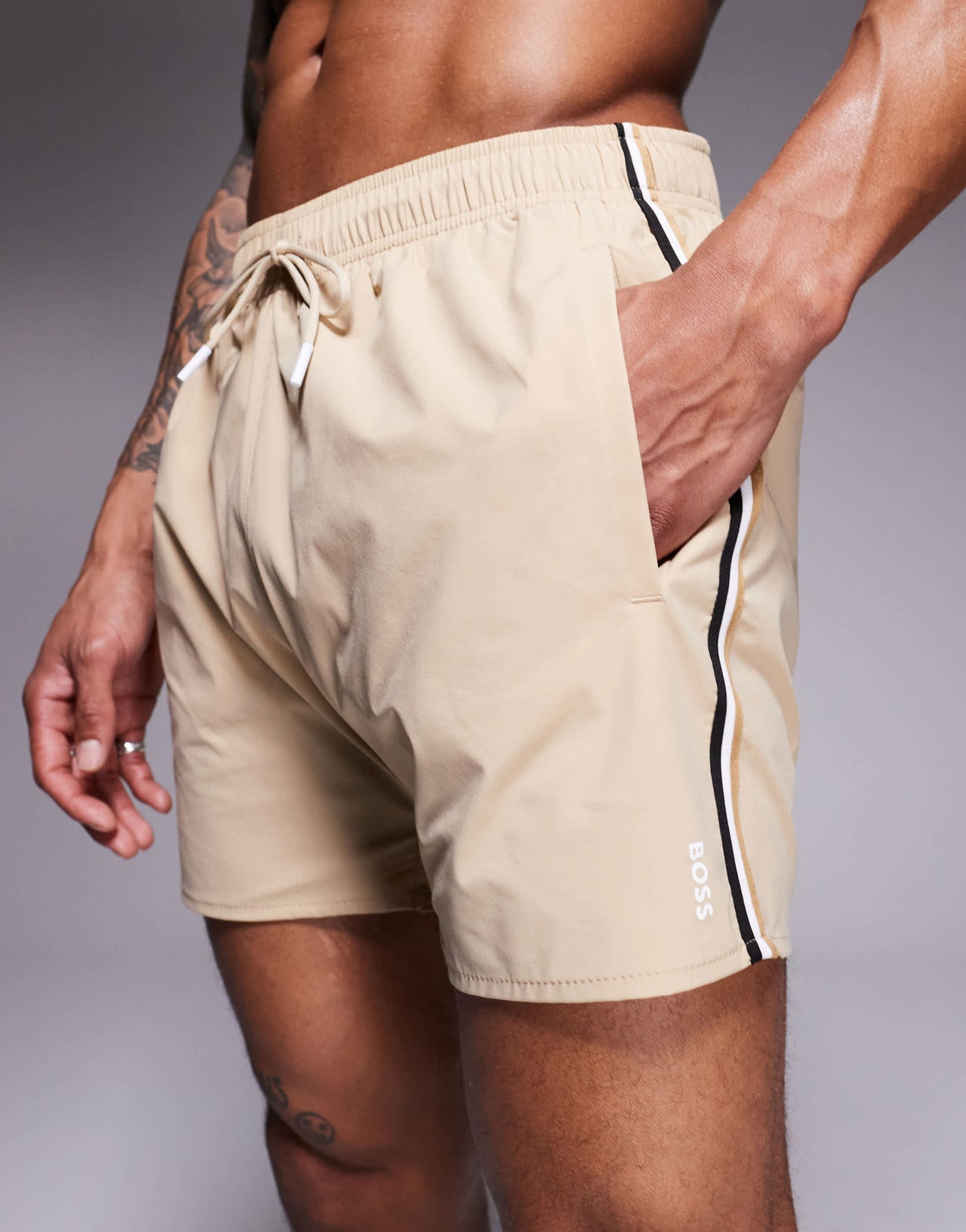 BOSS Iconic side stripe logo swim shorts  in light beige